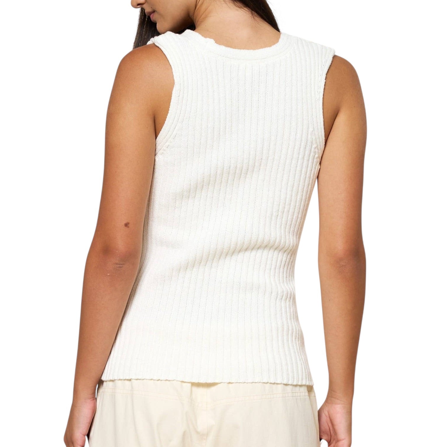 White ribbed tank top worn by a person on a white background