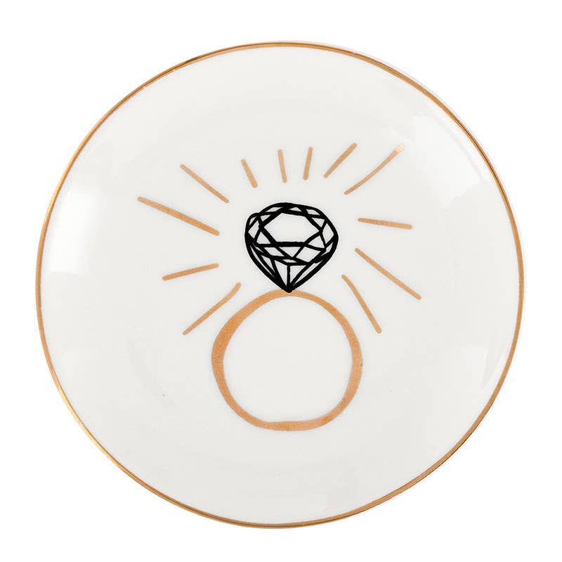 White plate with a black diamond design and gold accents on a white background