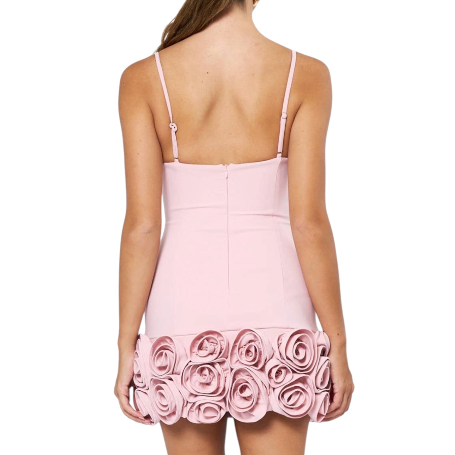 Pink dress with floral details on a white background