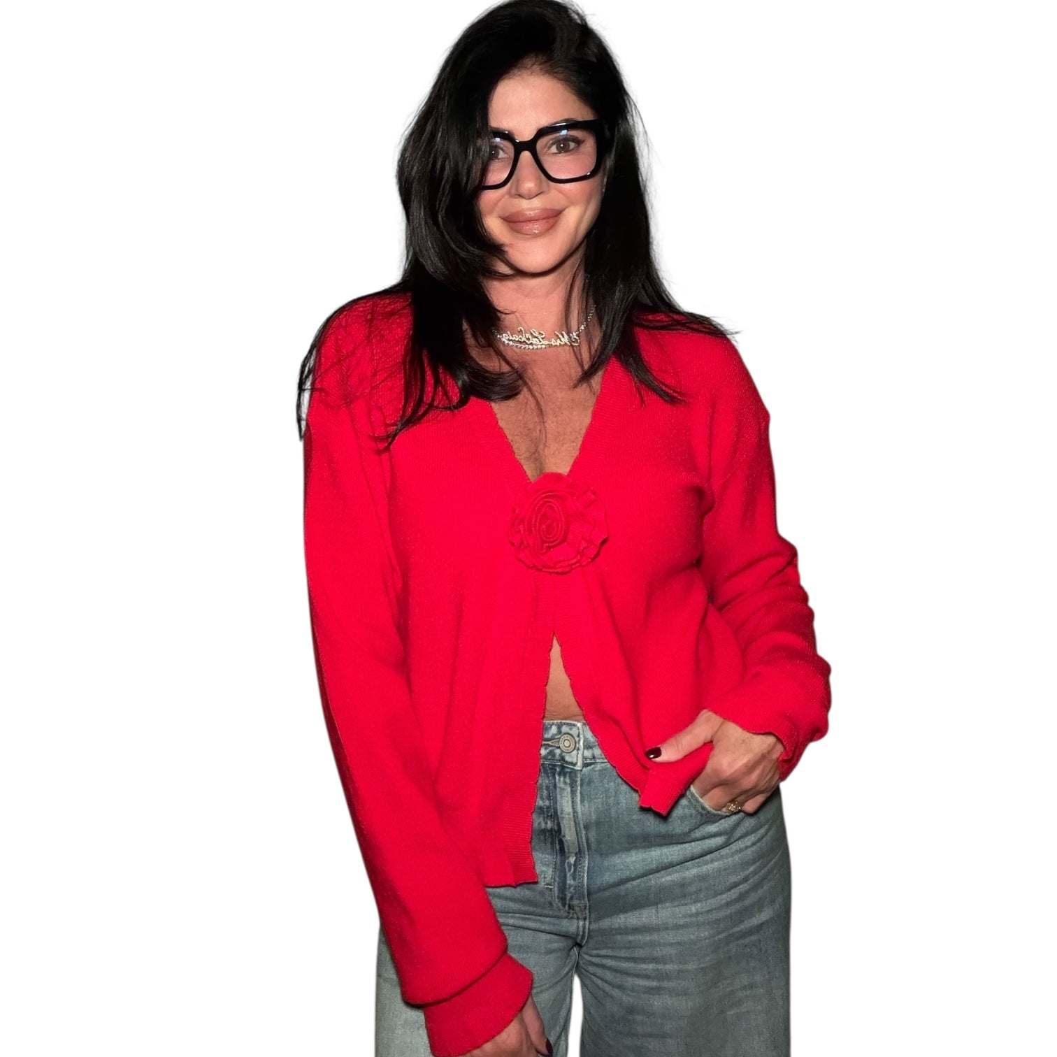 Person wearing a red blouse and blue jeans on a white background
