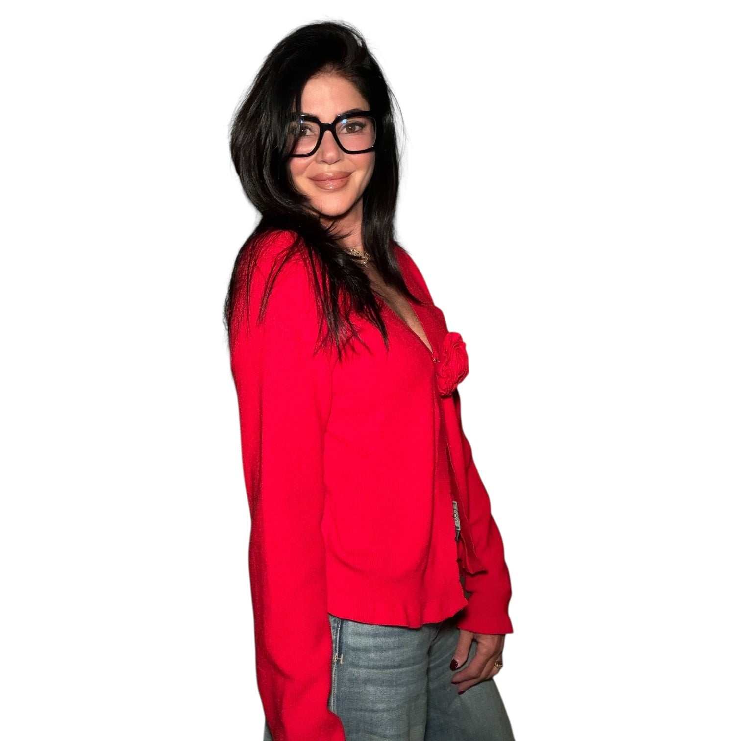Woman wearing a red blouse with a knot detail on a white background