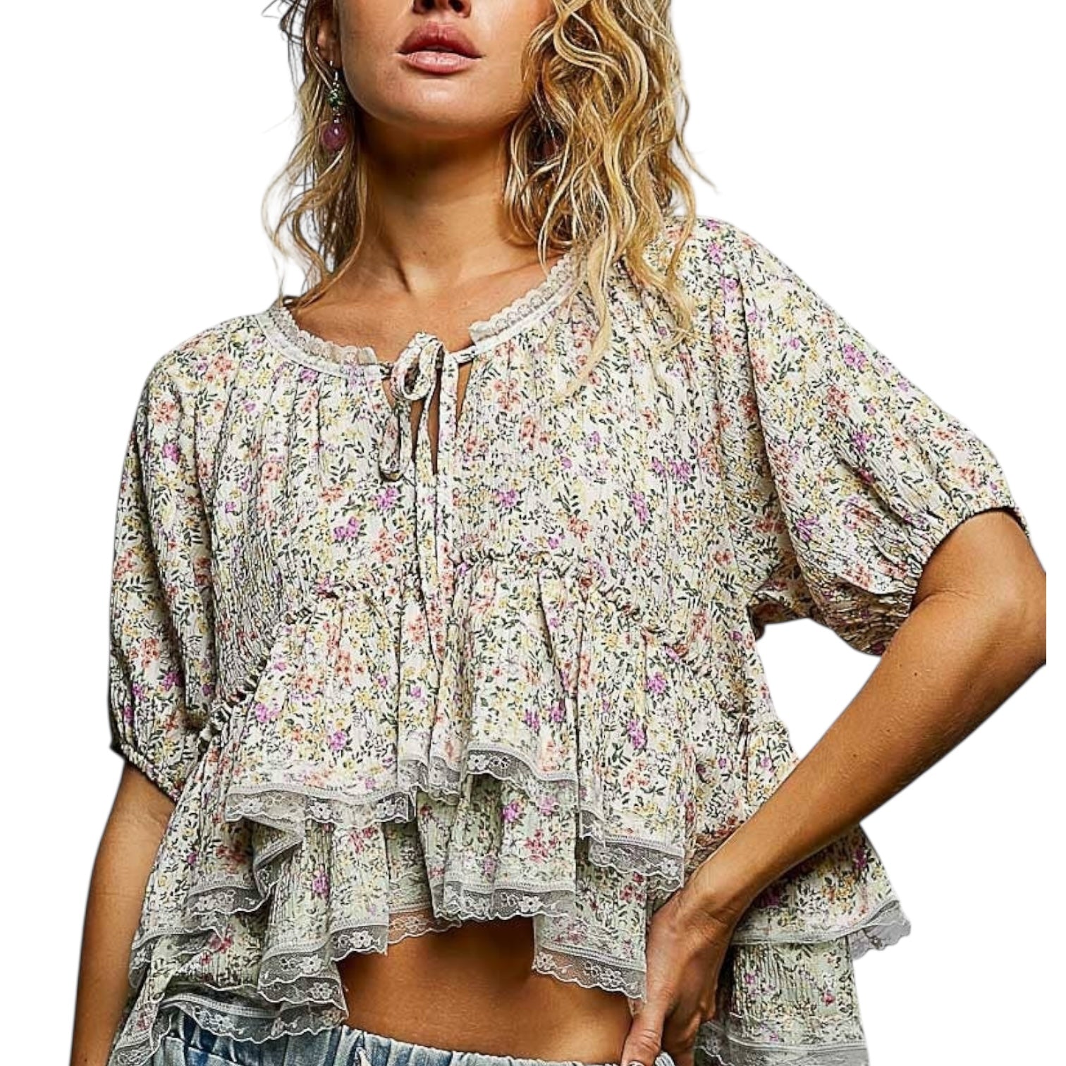 Woman wearing a floral blouse with a white background