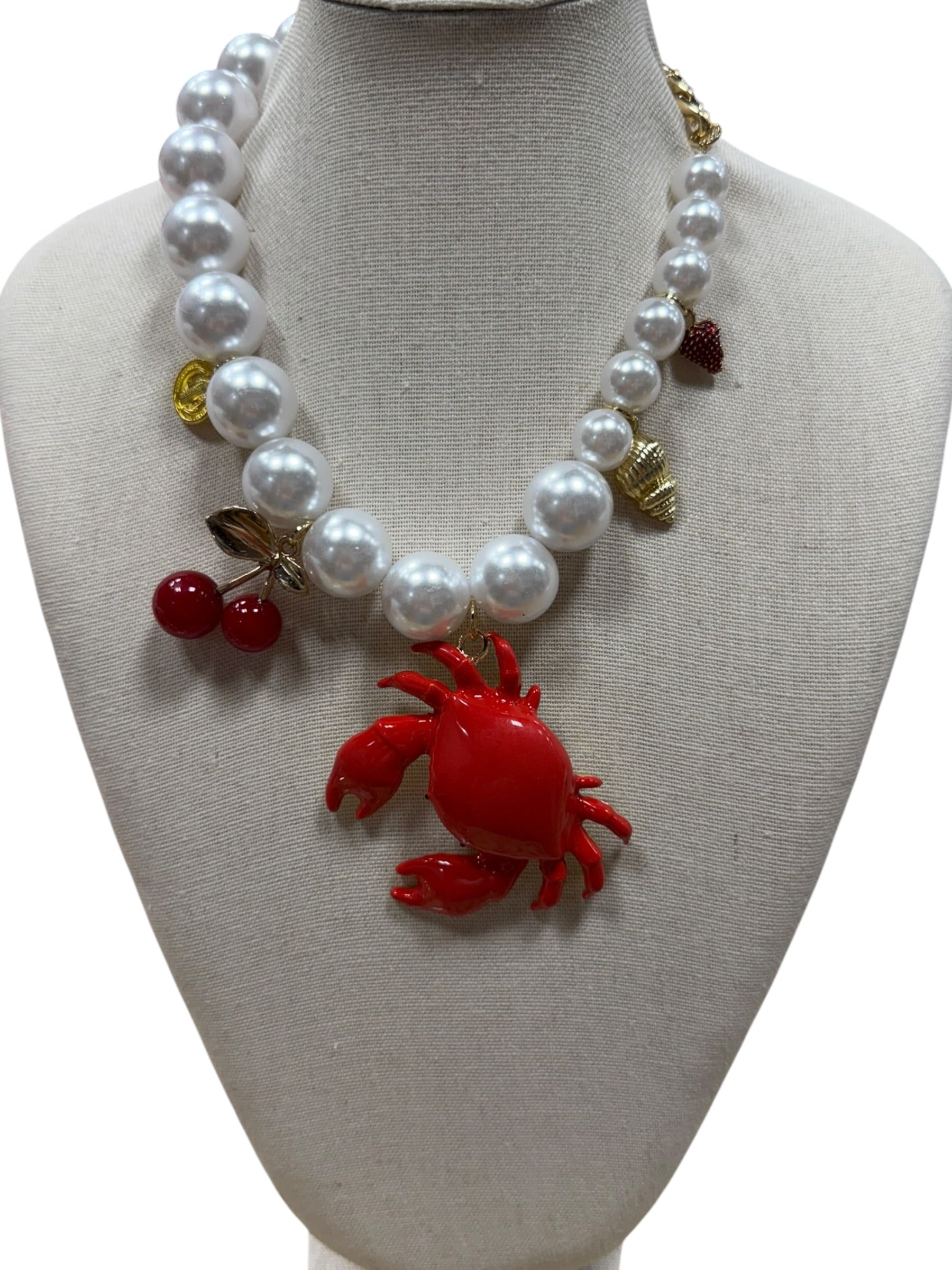 pearl necklace with crab, cherry, strawberry, coin and shell