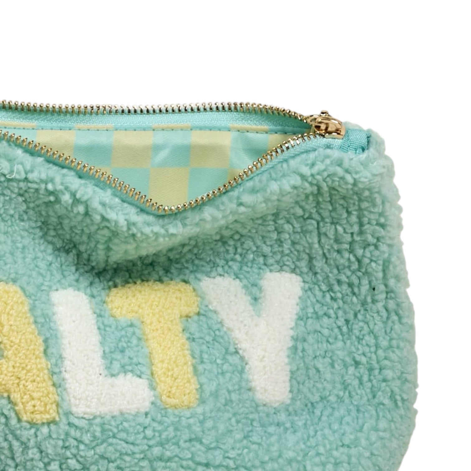 Teal furry pouch with 'SALTY' text on a white background