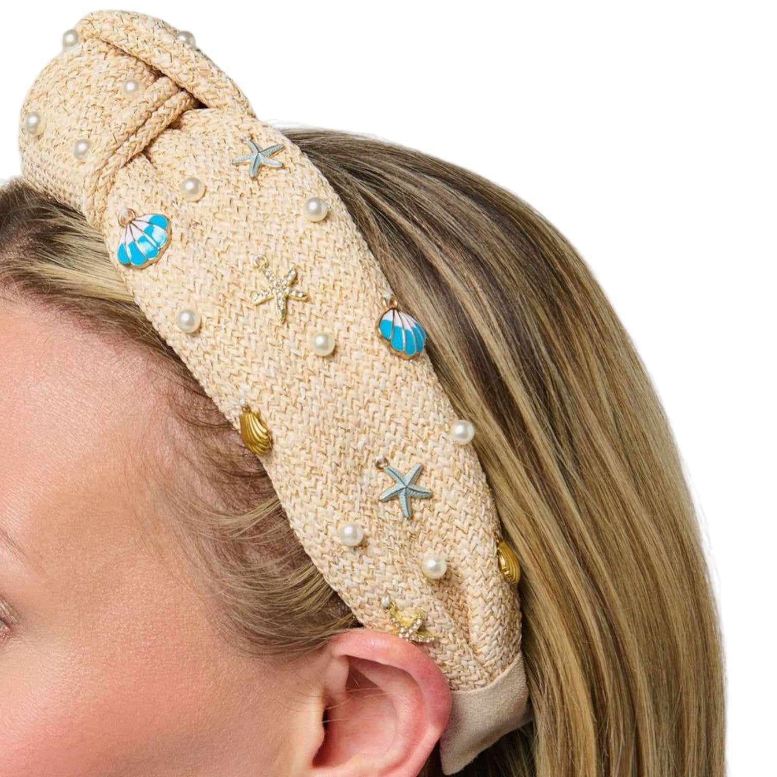 natural knotted headband with pearls and seashell charms on white background