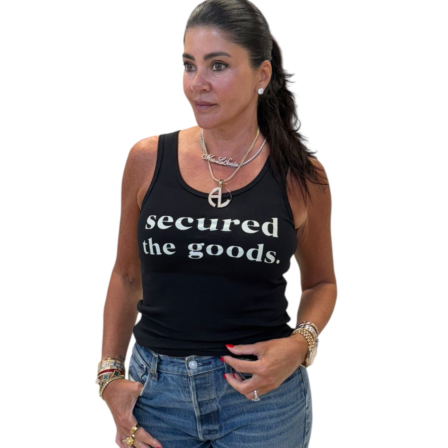 Woman wearing a black tank top with 'secured the goods' text on a white background