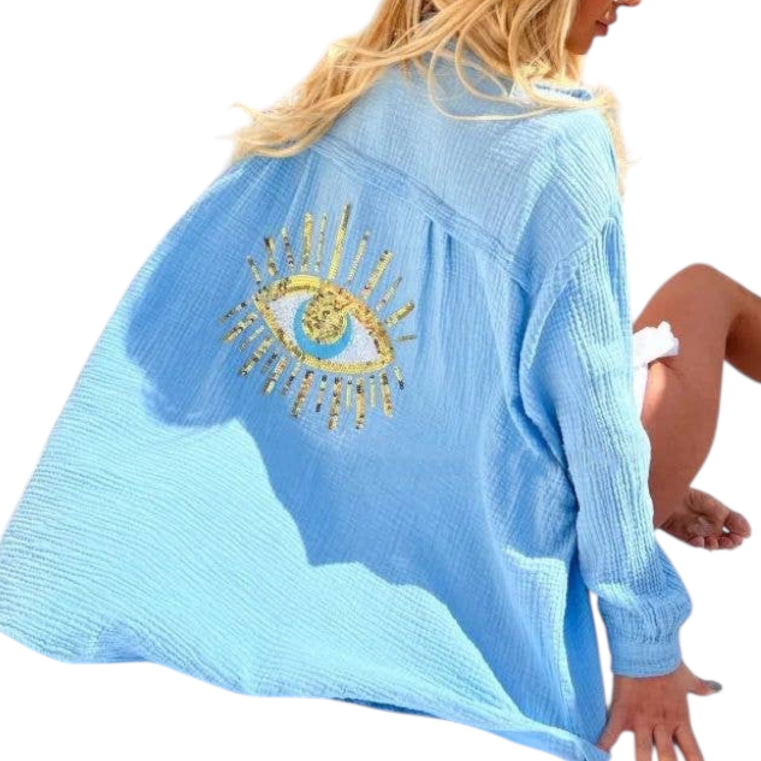 Light blue gauze shirt with a gold eye design on a white background