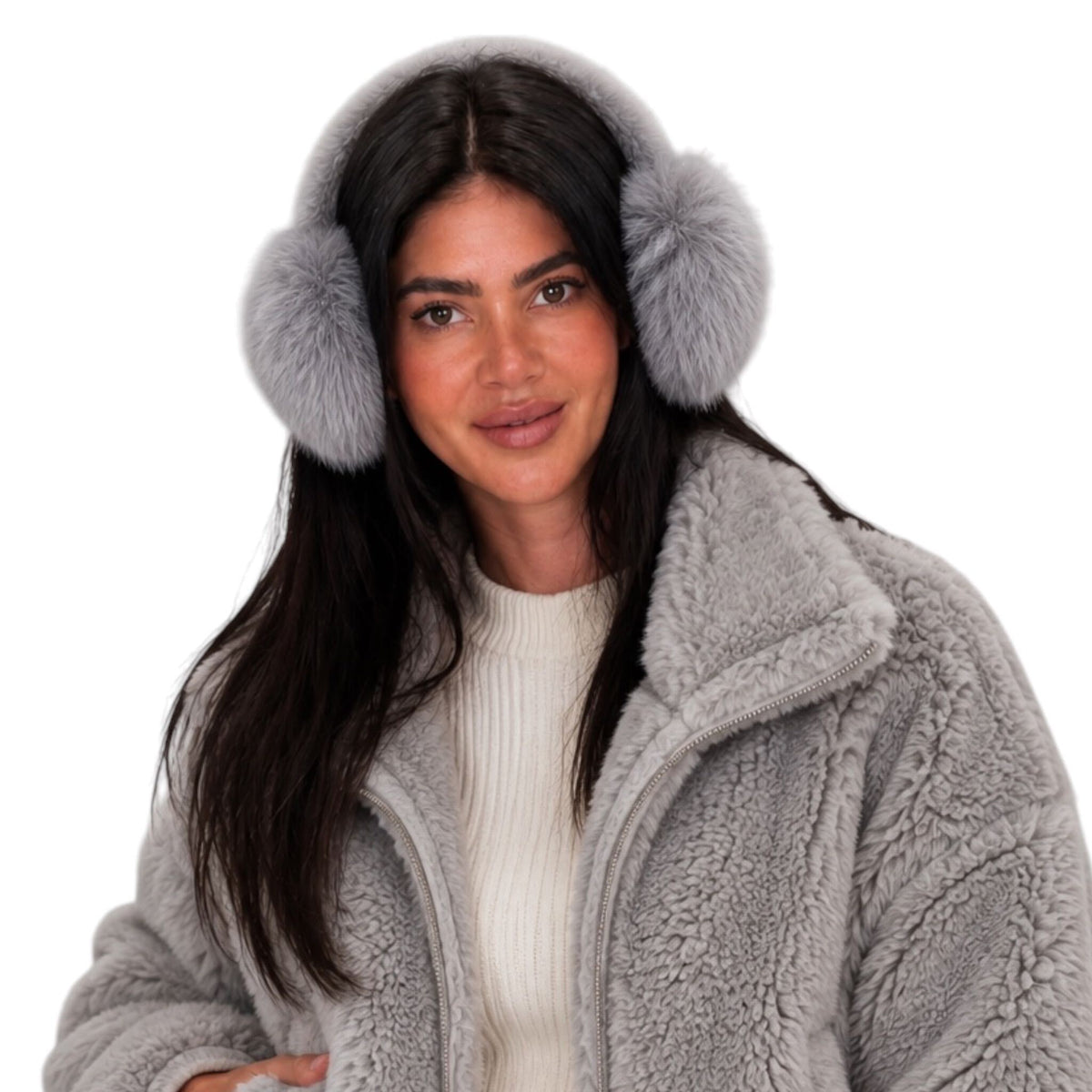 A woman wearing gray faux-fur earmuffs and a matching gray sherpa fleece jacket over a cream ribbed sweater, photographed against a solid white background.