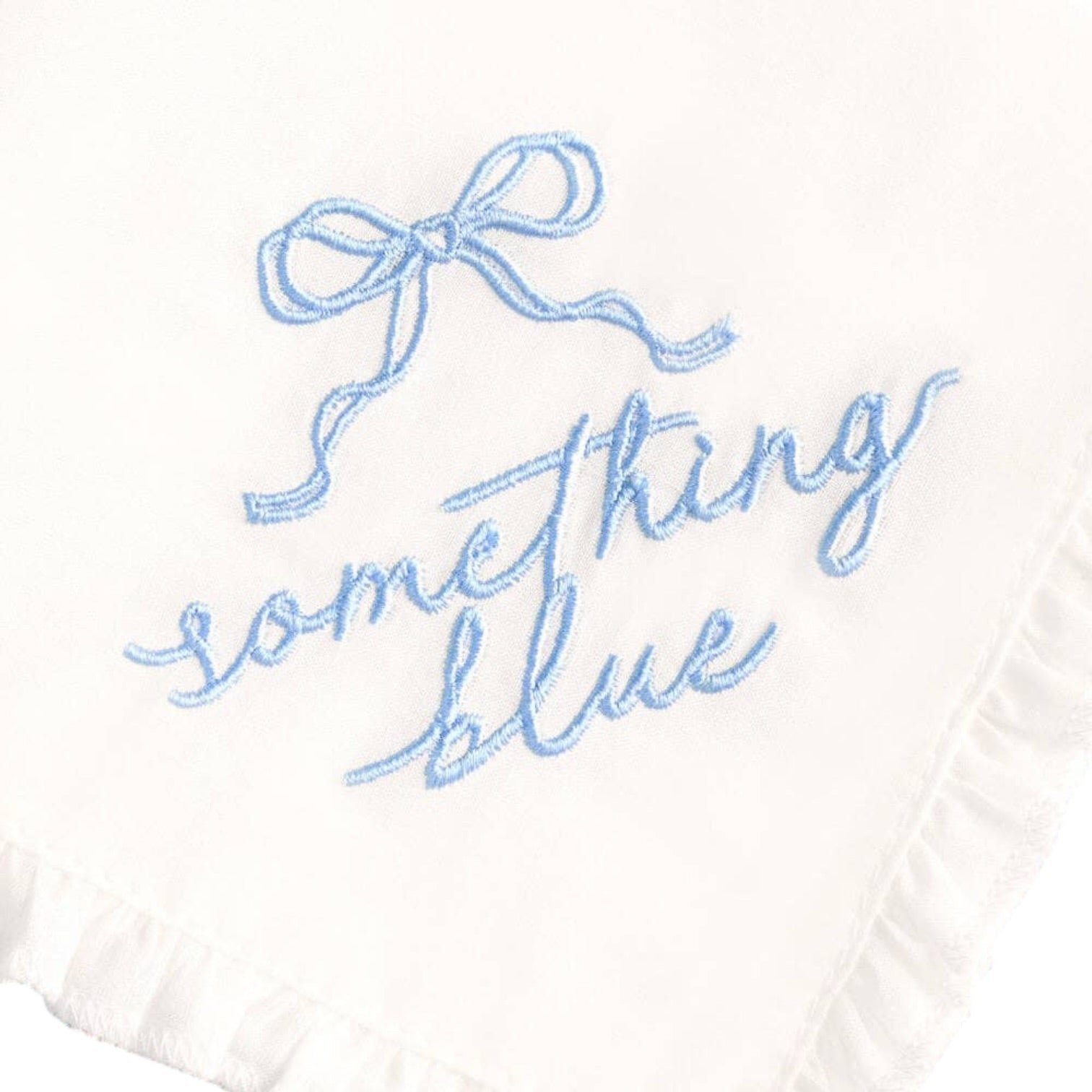 Embroidered phrase 'something blue' with a bow on a white background