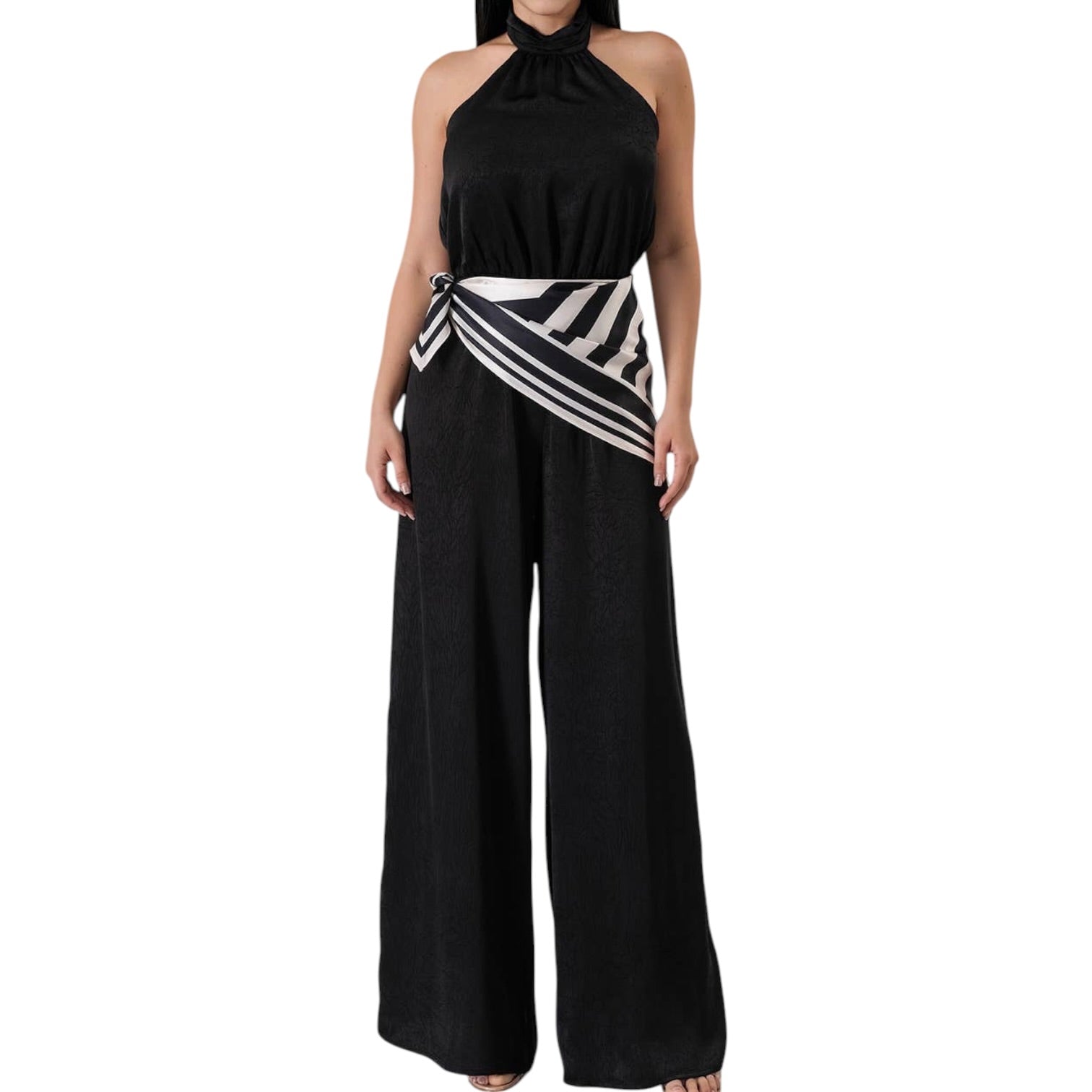 Black halter top and wide-leg pants jumpsuit with pattern belt on a white background