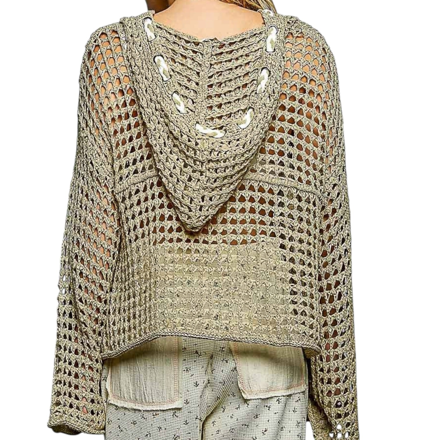 Crocheted sweater with openwork design on a white background