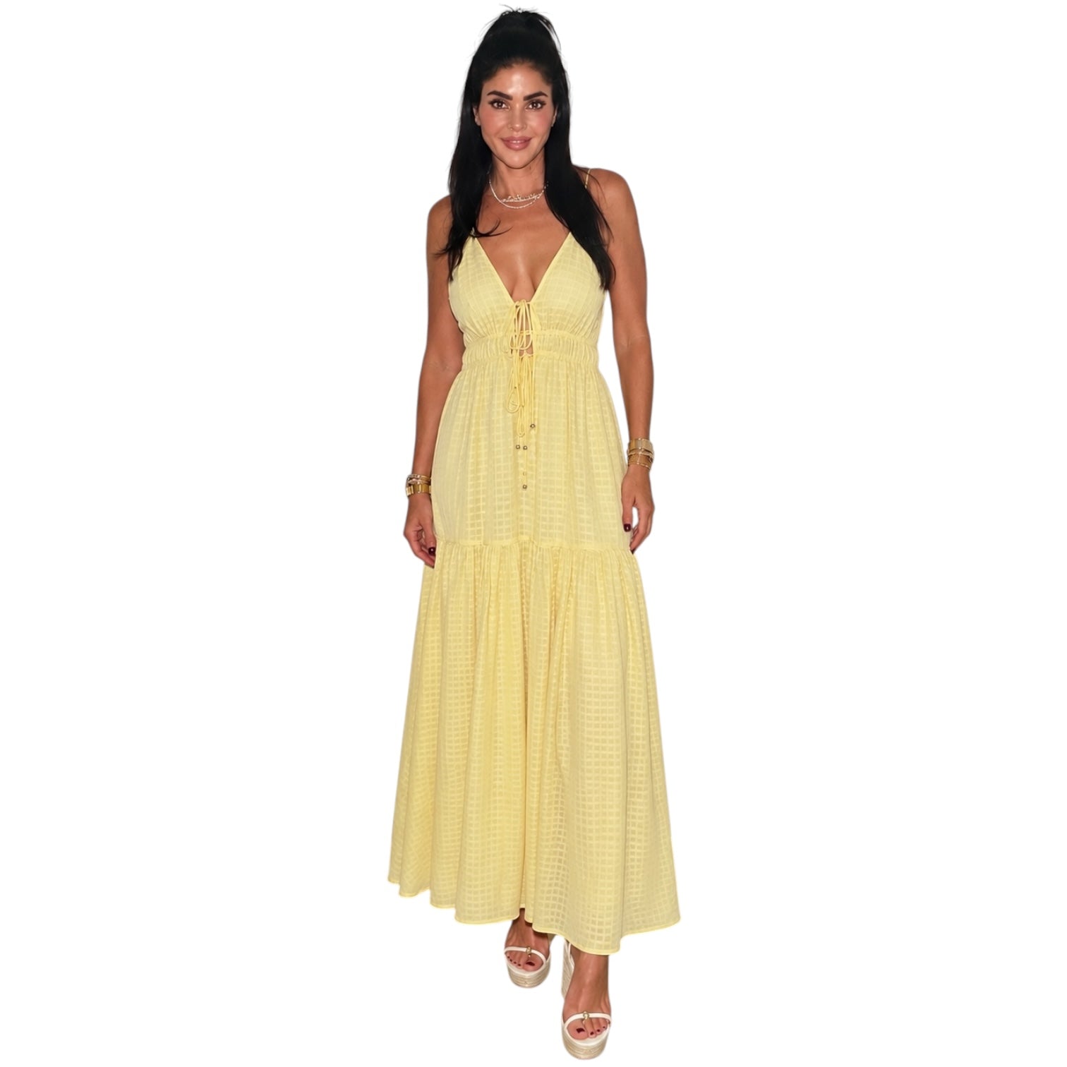 Woman wearing a yellow dress on a white background