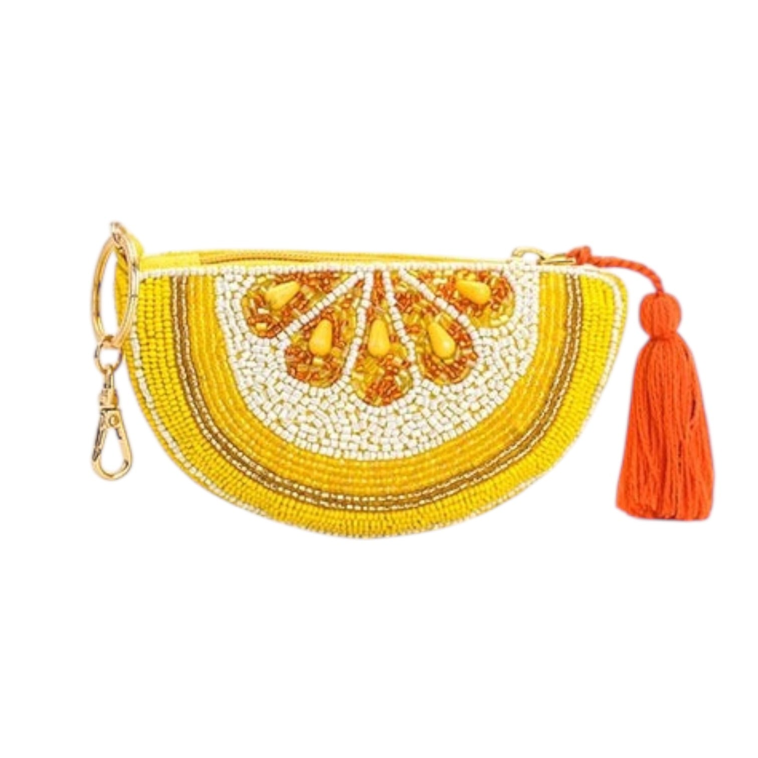 Yellow beaded clutch with gold accents and an orange tassel on a white background