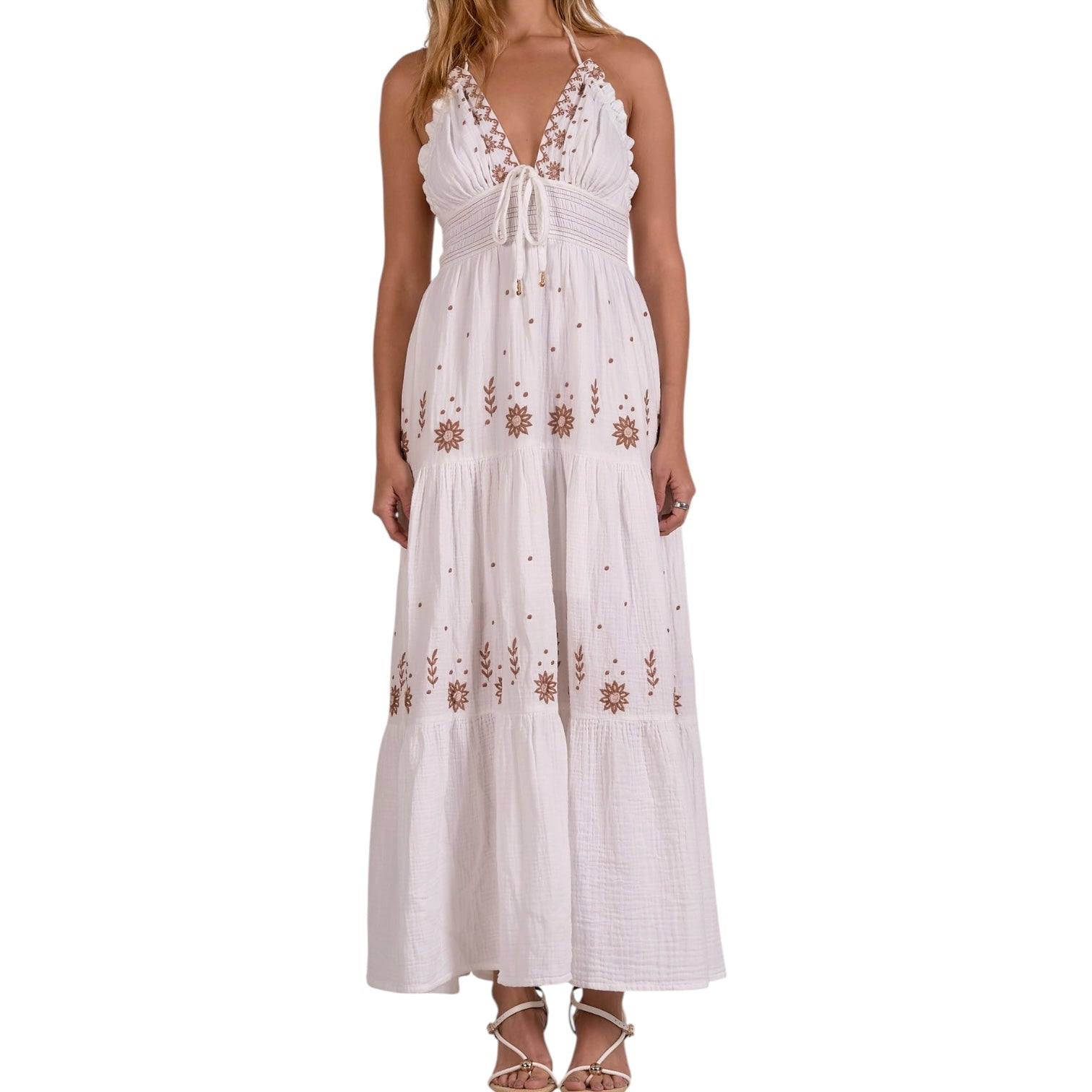 White dress with floral embroidery on a white background