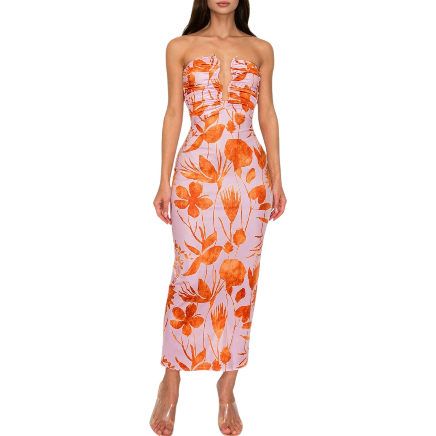 Woman wearing a strapless dress with orange floral pattern on a white background