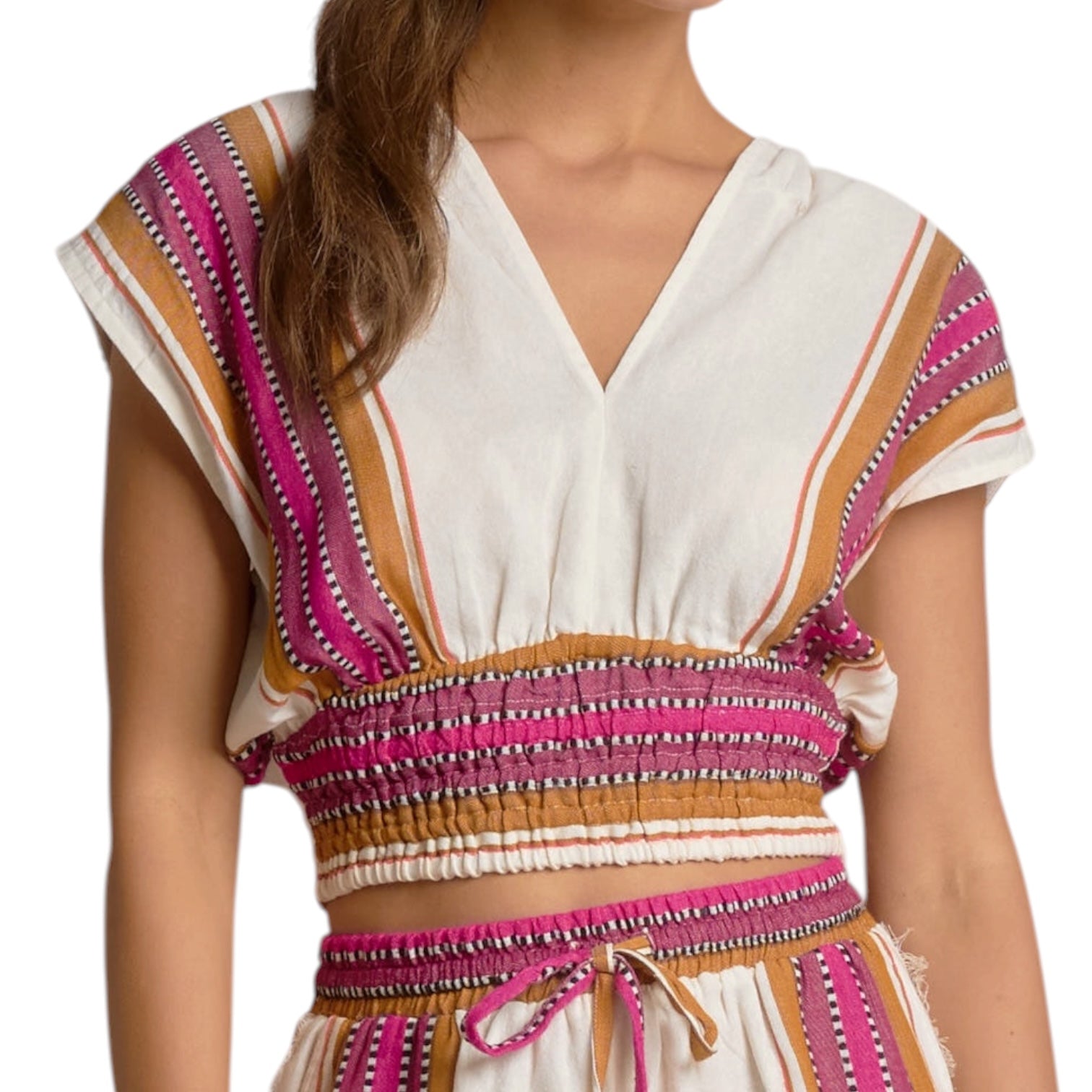 Woman wearing a colorful striped top with a white background