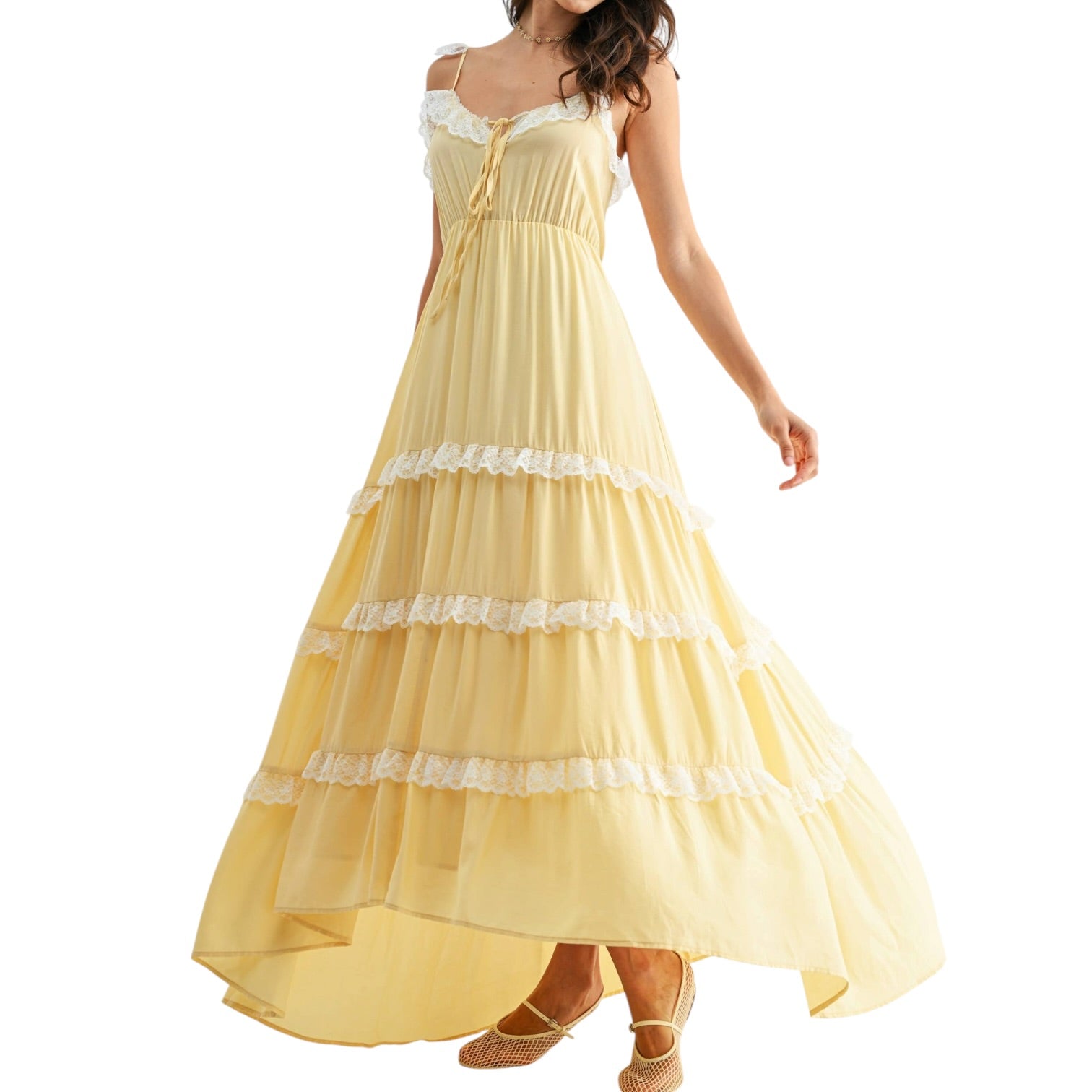 Yellow dress with white lace details on a white background
