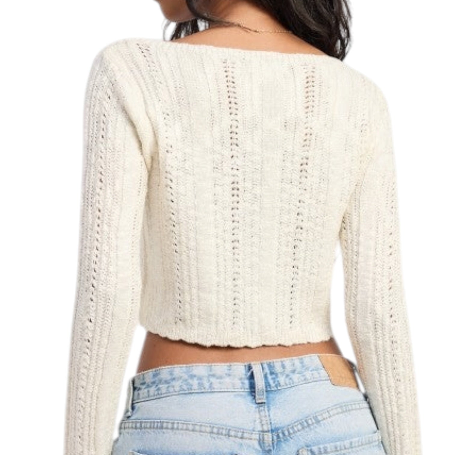 White knitted crop top worn by a person on a white background