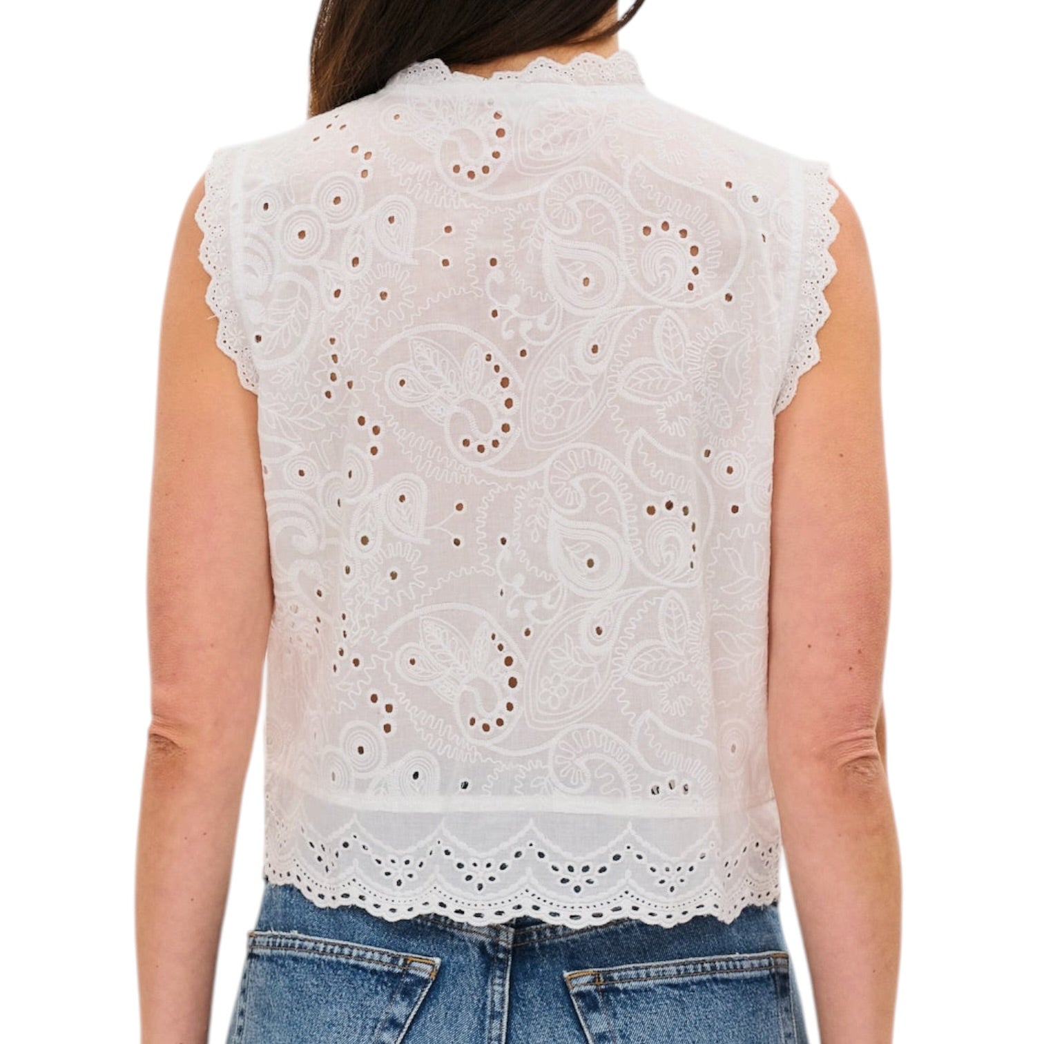 White lace top worn by a person on a white background