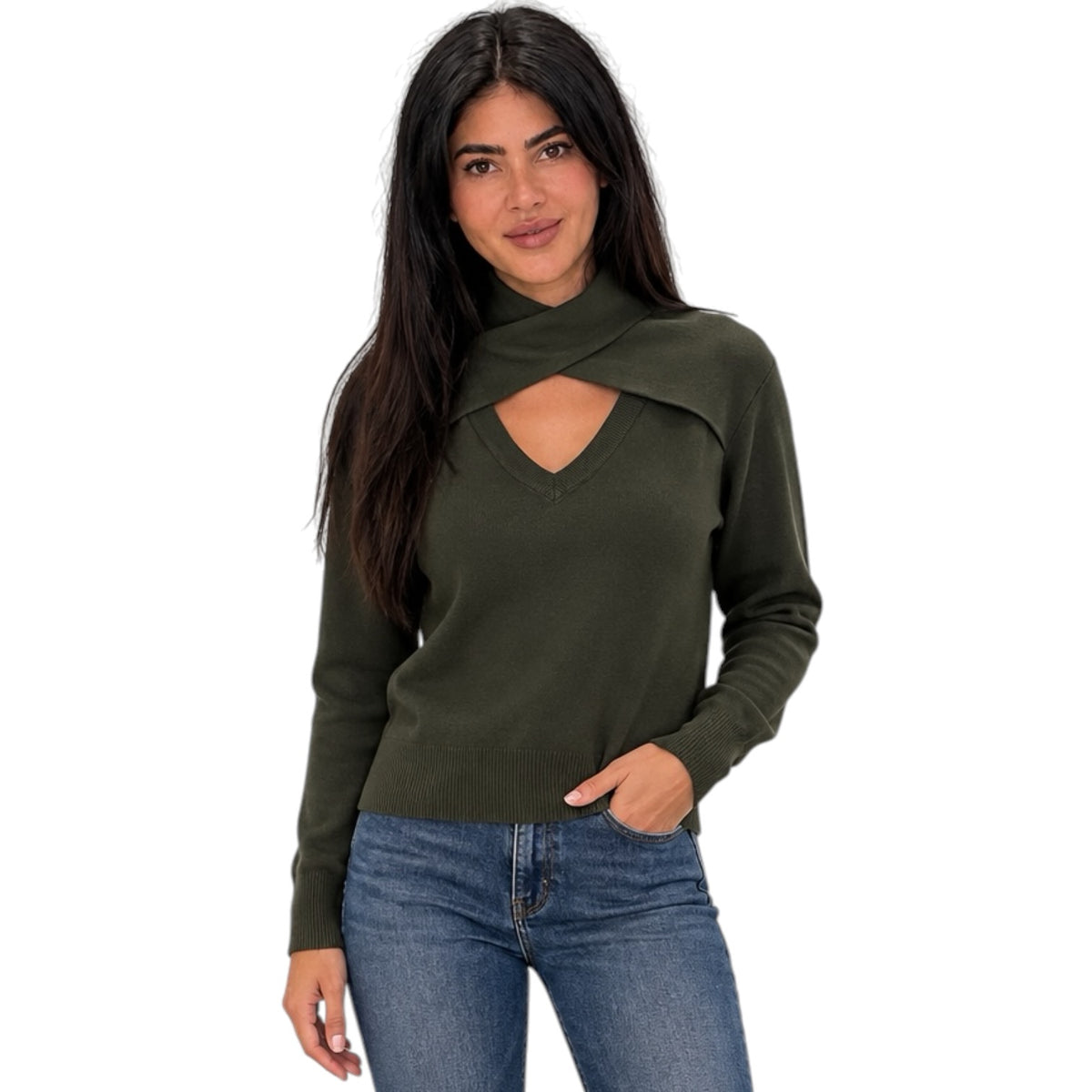 A woman modeling an olive green knit sweater with a unique wrap-around collar and keyhole cutout at the chest, paired with blue jeans against a plain white background.