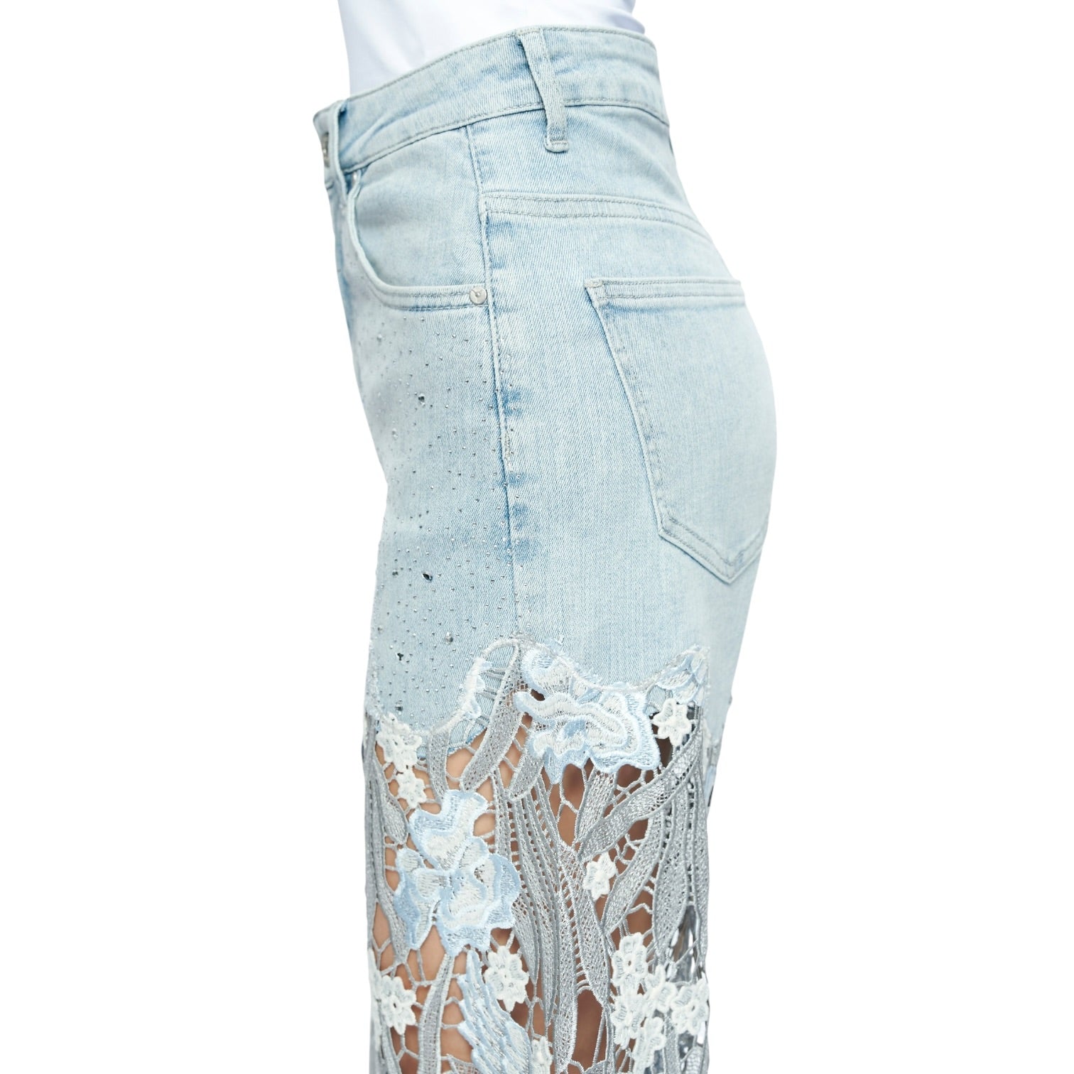Light blue jeans with lace detailing on a white background