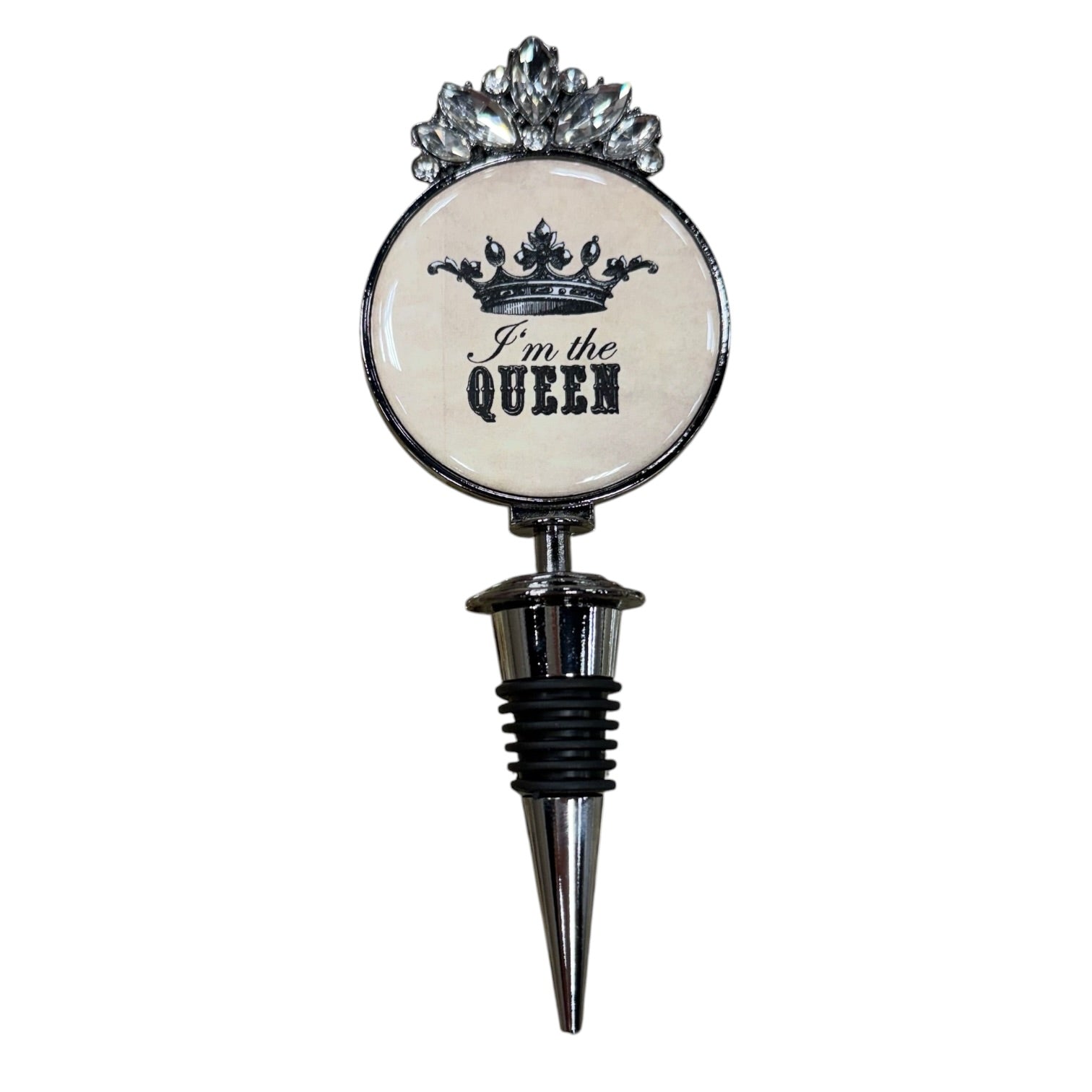 A novelty wine bottle stopper featuring a round white face with a black crown graphic and the text 'I'm the QUEEN' in black script and block lettering. The top of the round section is decorated with a silver-toned crown-like embellishment, and the stopper body below is silver metal with a black rubber grommet.