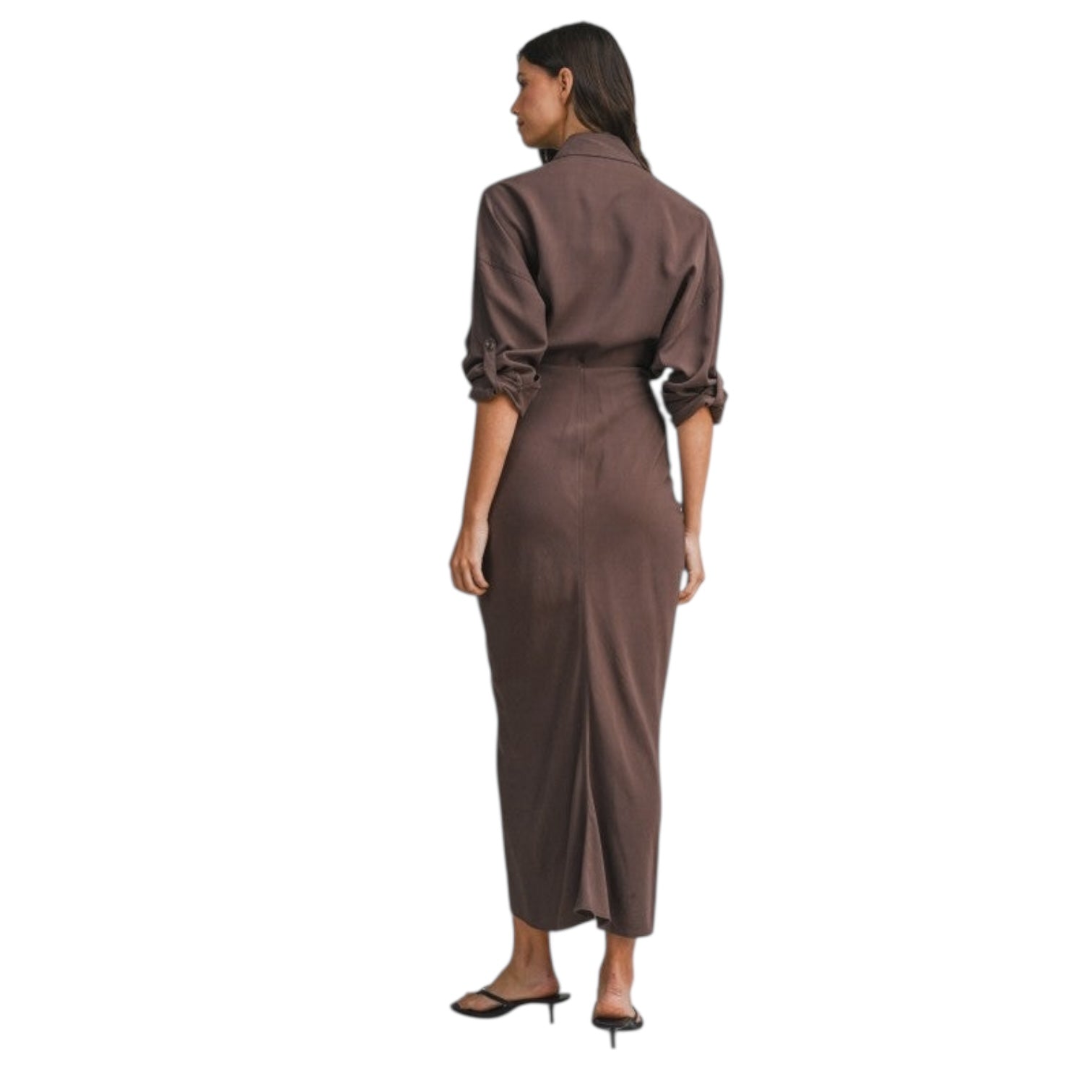 Woman wearing a brown jumpsuit on a white background