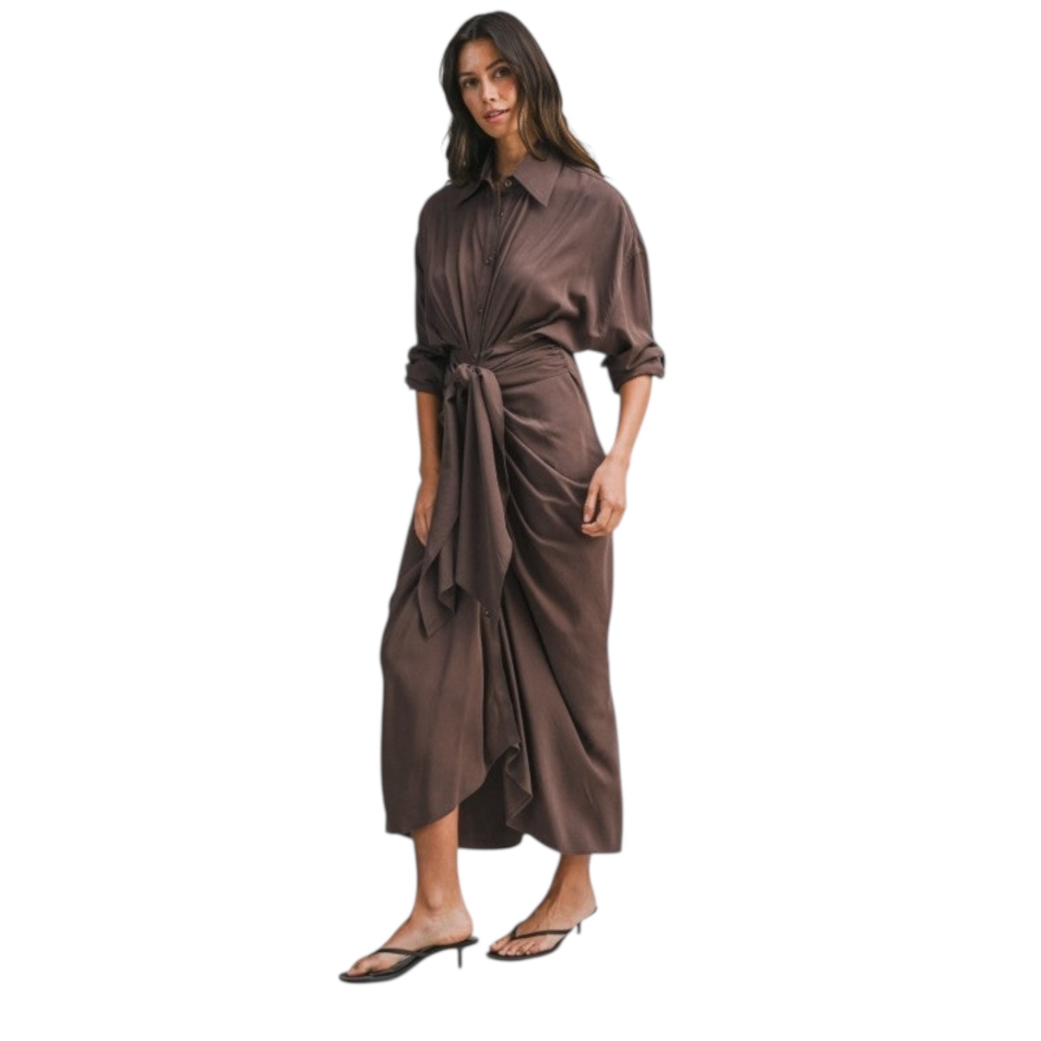 Woman wearing a brown satin dress on a white background