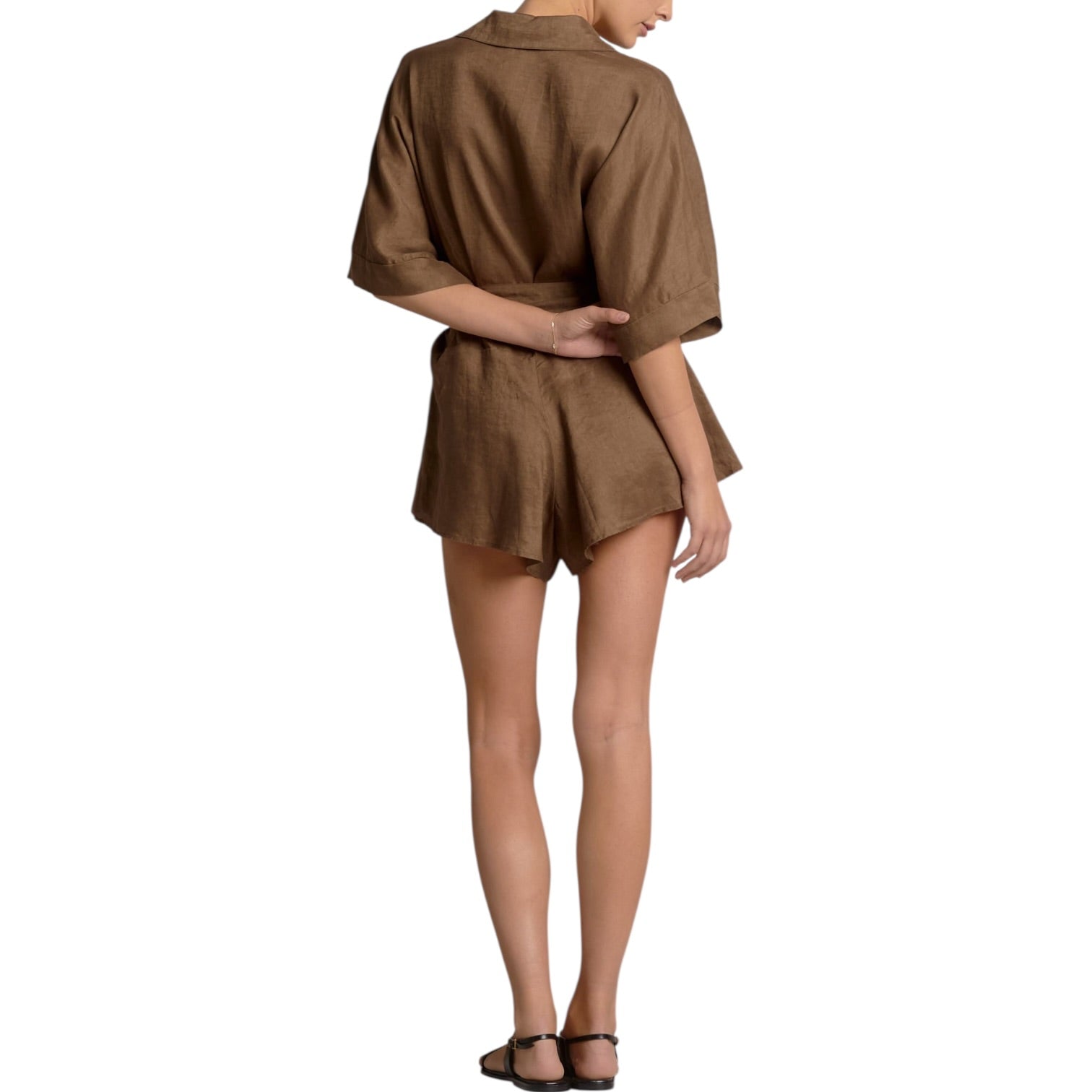 Brown romper worn by a person on a white background