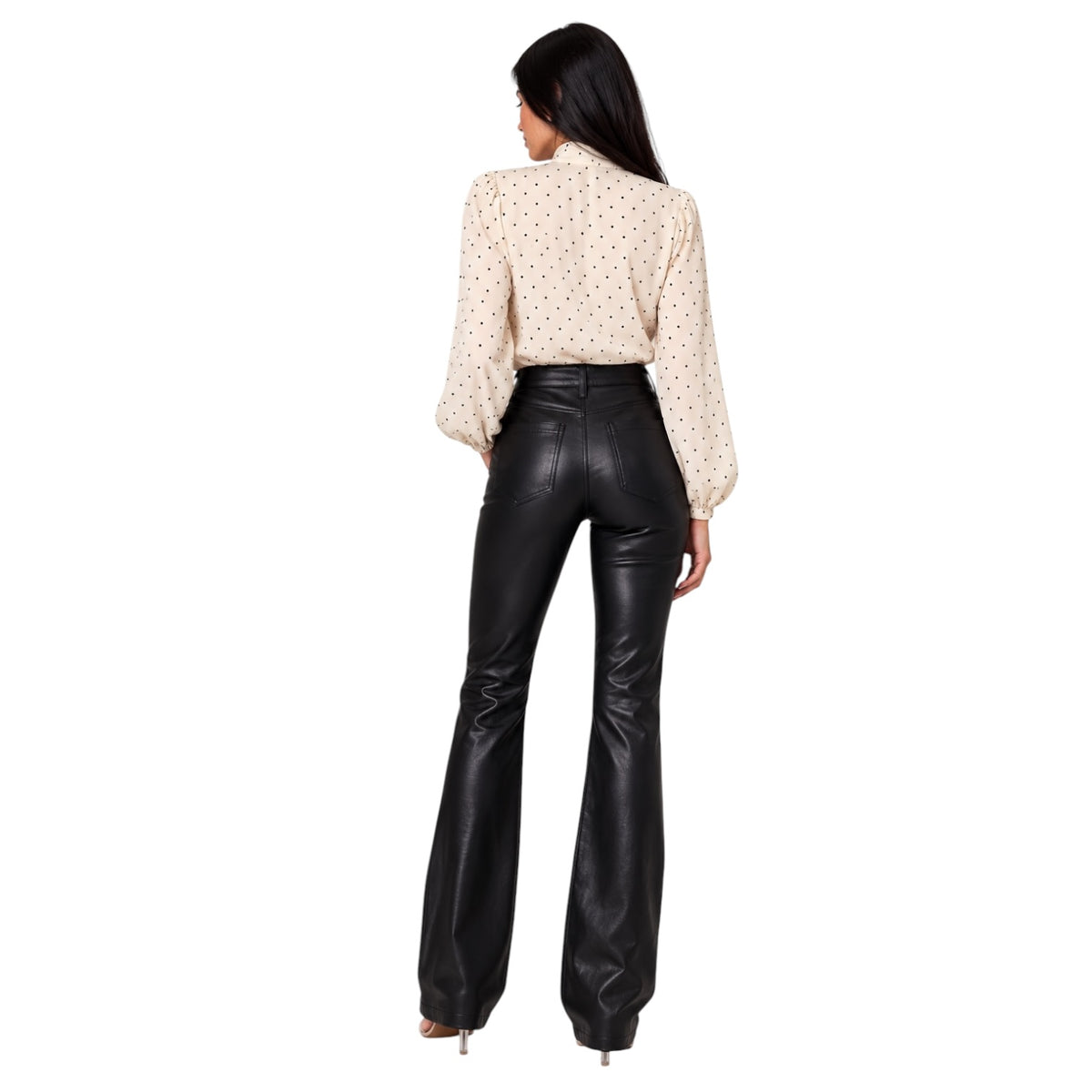A model wearing black faux leather pants
