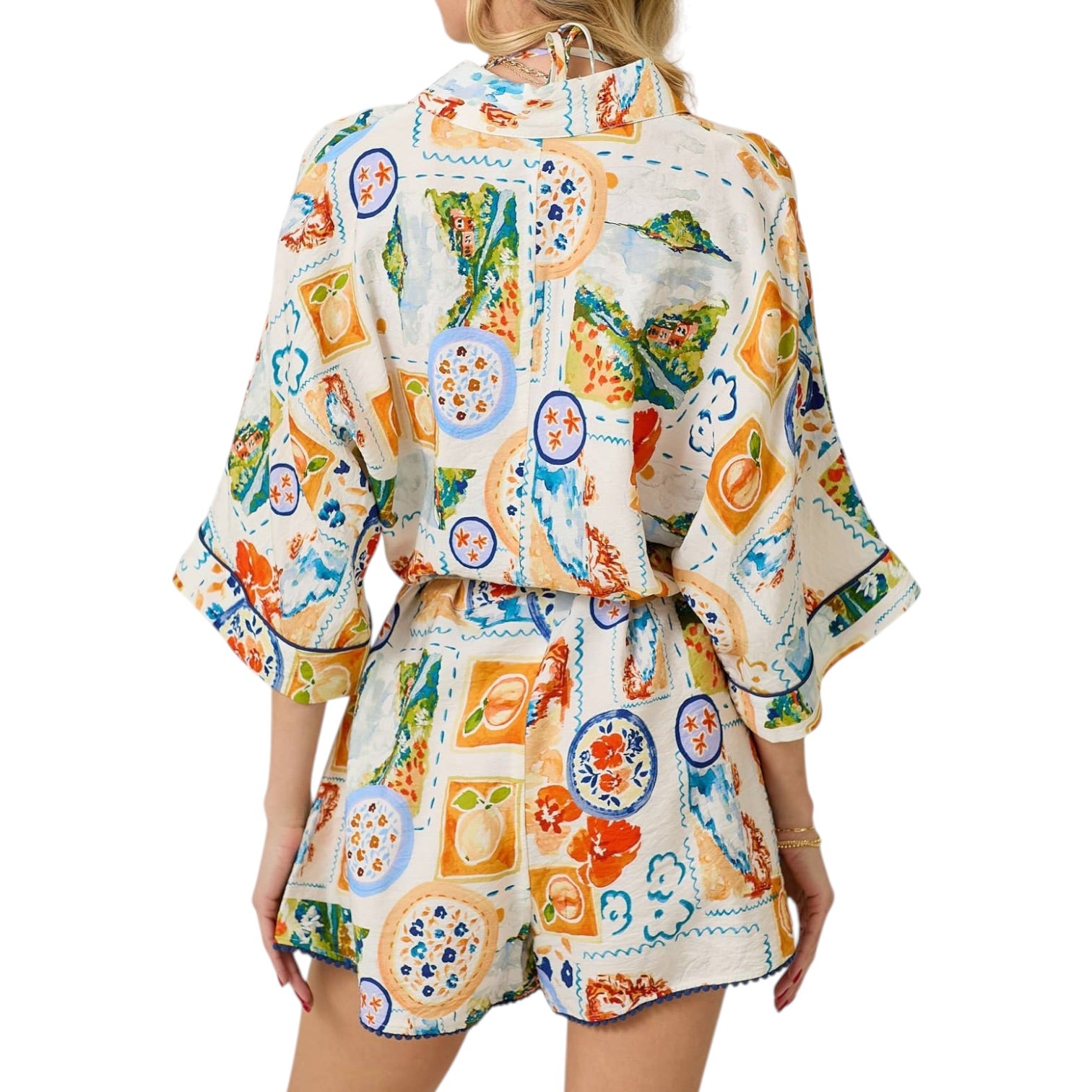 Woman wearing a colorful patterned outfit on a white background