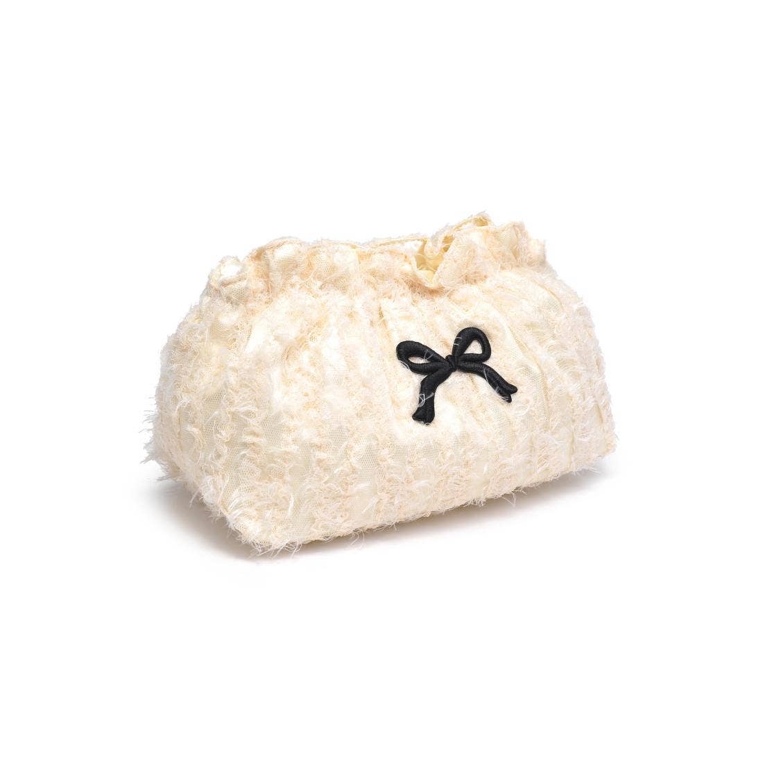 White fluffy toy with a black bow on a white background