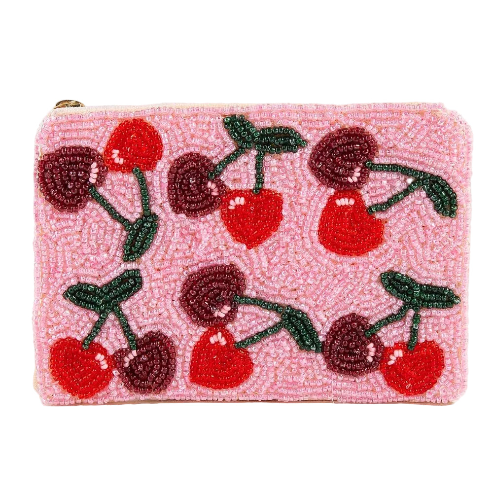 Pink beaded clutch with cherry design on a white background