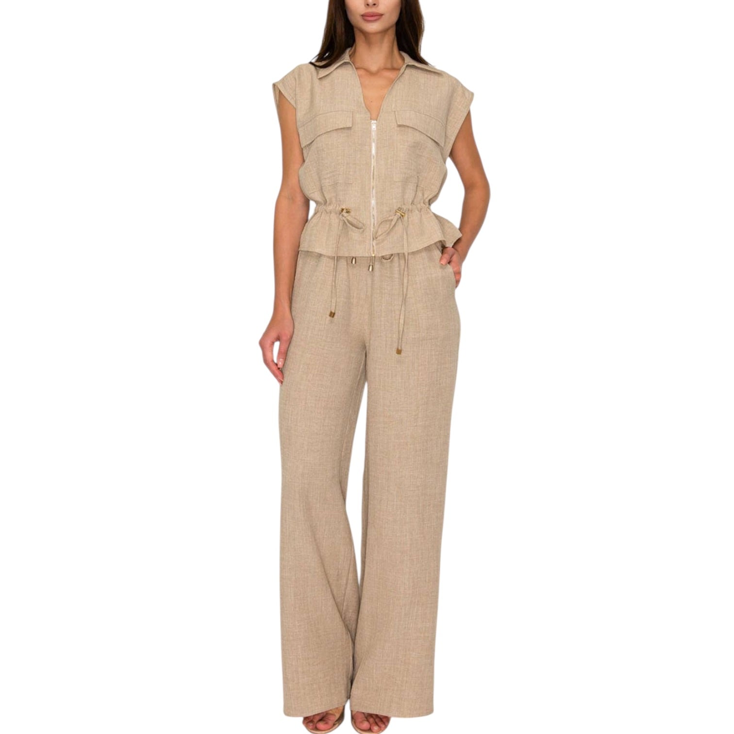 Woman wearing a beige set on a white background