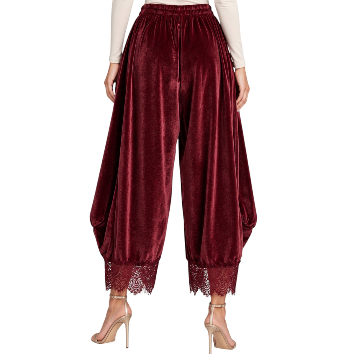 A pair of women's balloon-style velvet pants in deep burgundy, featuring a lace hem and elastic waistband, shown on a model from the back against a white background.