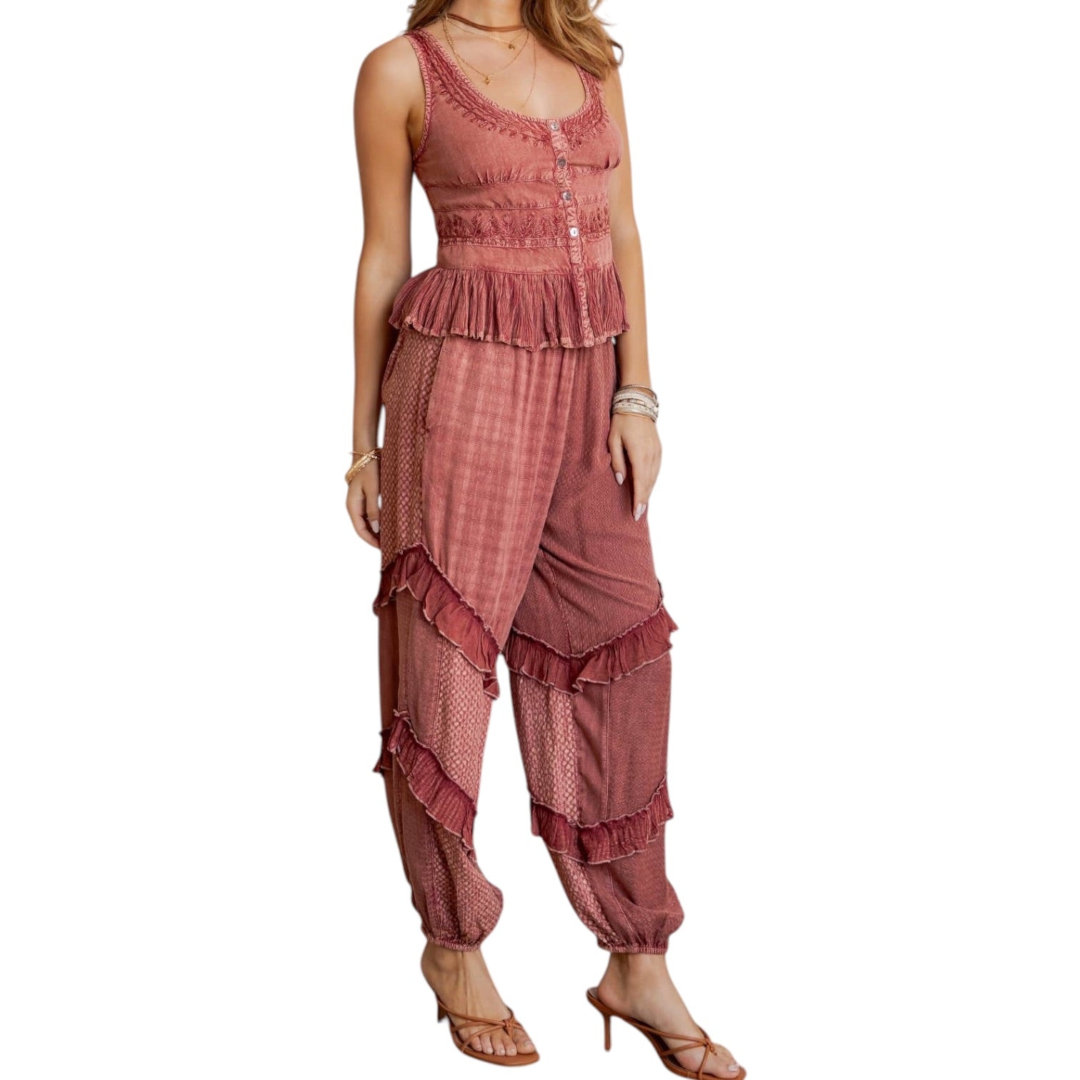 Woman wearing a pink ruffled outfit on a white background