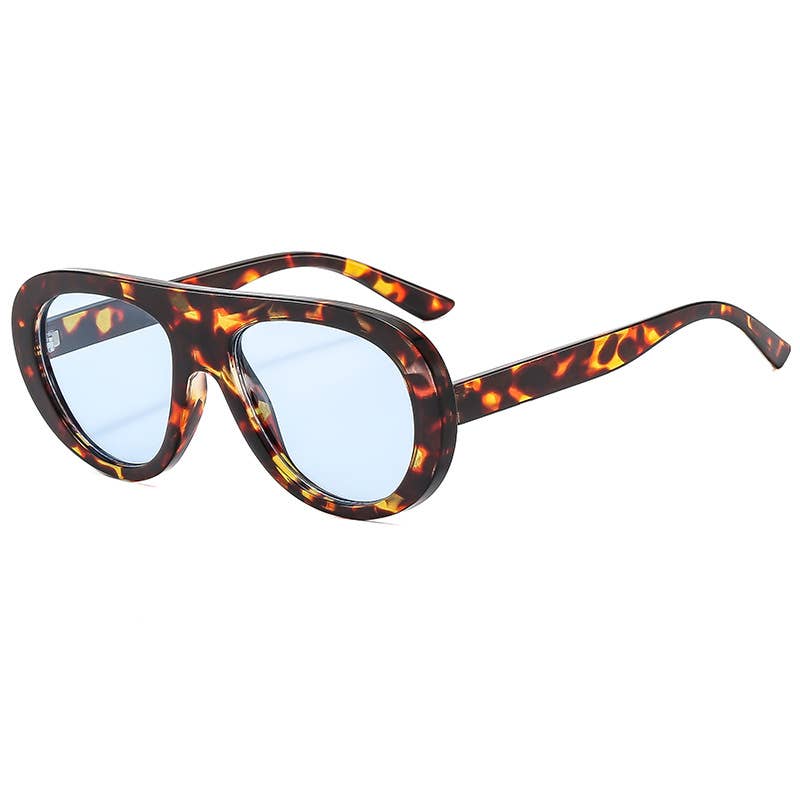Tortoiseshell sunglasses with blue lenses on a white background