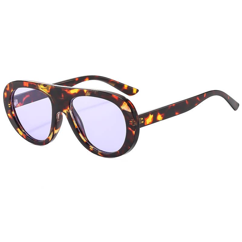 Sunglasses with tortoiseshell frame and purple lenses on a white background