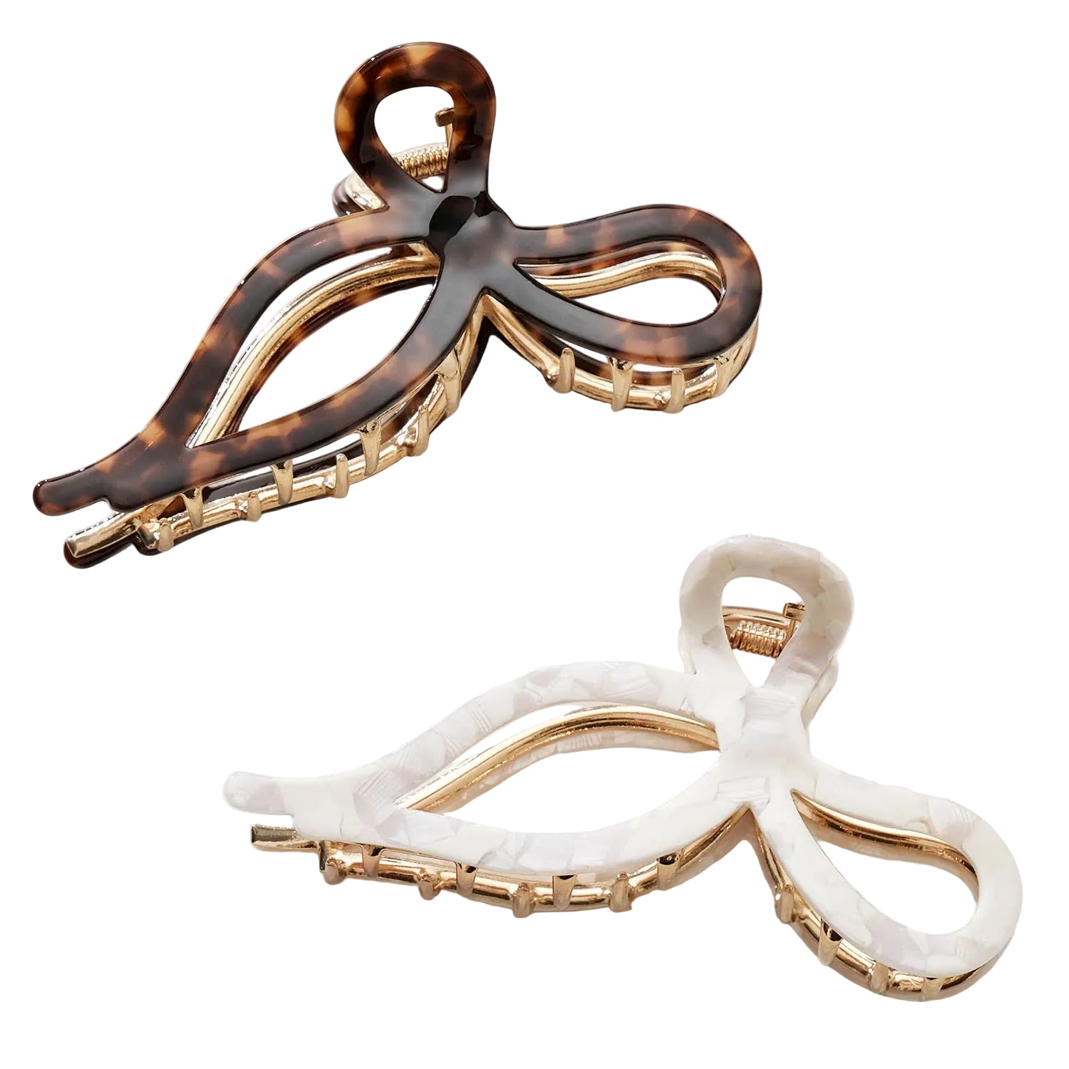 Two hair clips, one tortoiseshell and one white, on a light background.