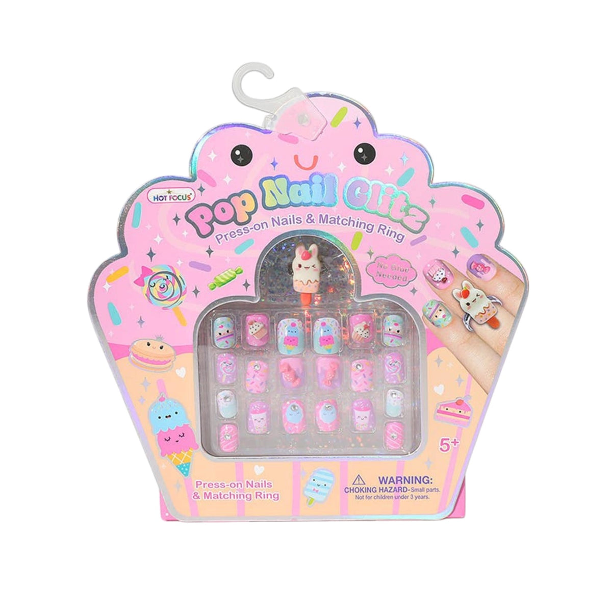A package of Pop Nail Oils press-on nails and matching rings in a cute pink cupcake-shaped box. The nails feature various pastel colors and whimsical cartoon designs, including a bunny and a unicorn, and are displayed in a clear window on the front of the packaging.
