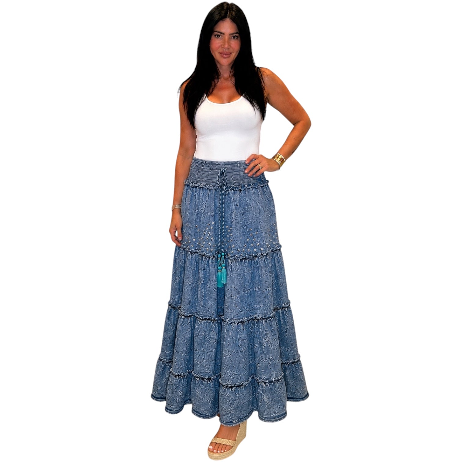 Woman wearing a long denim skirt on a white background