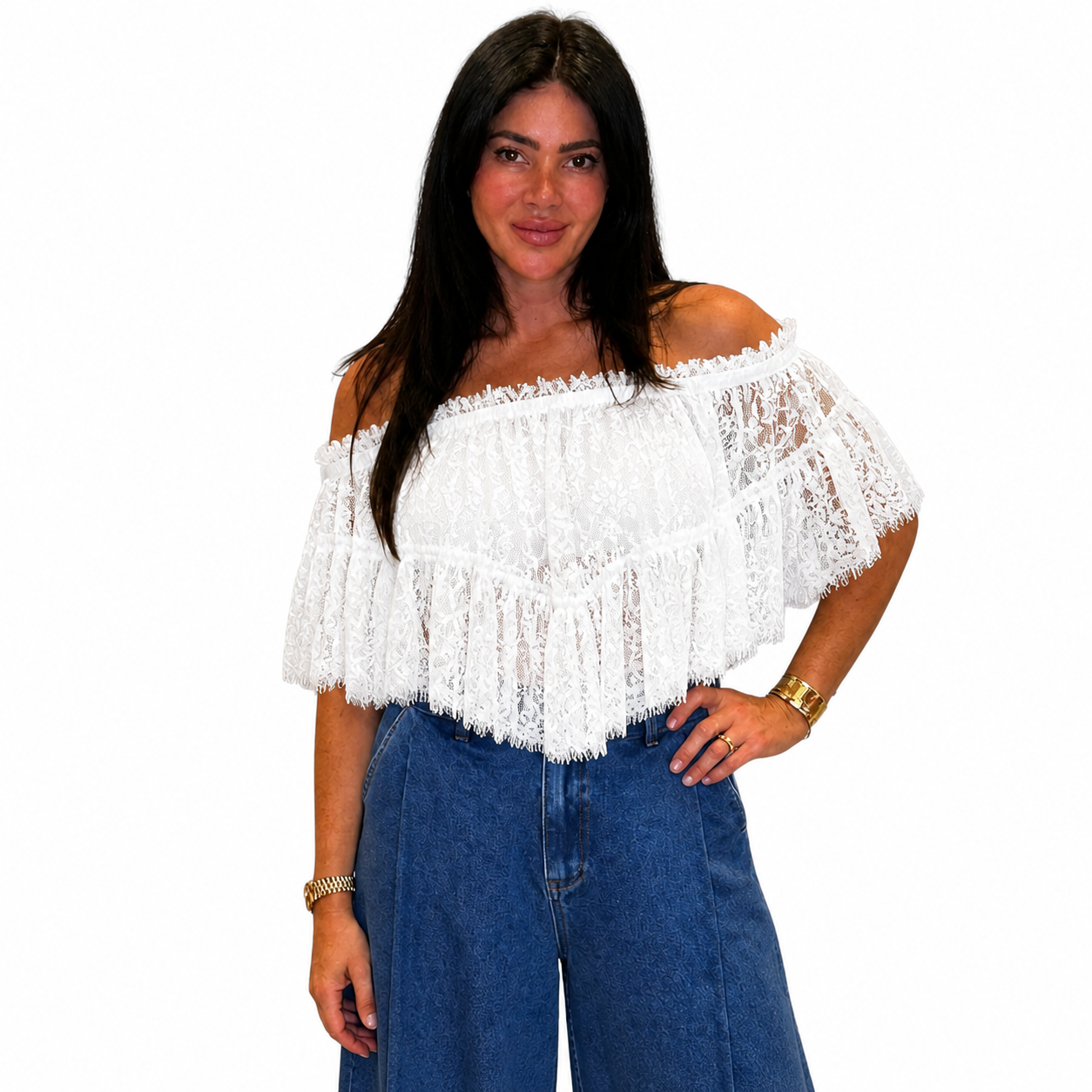 White lace off-shoulder top worn by a person on a white background