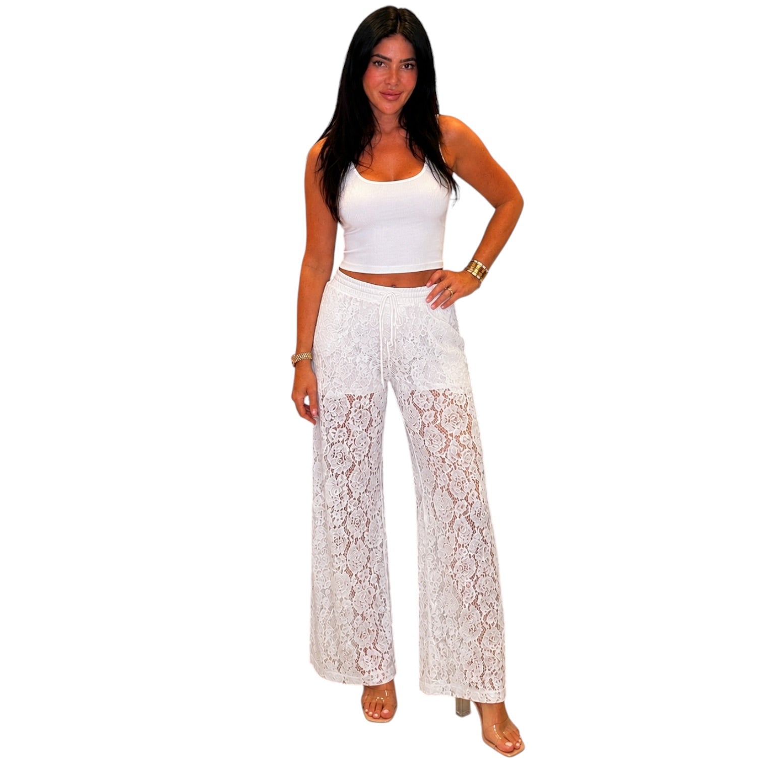 Woman wearing a white lace pants on a white background