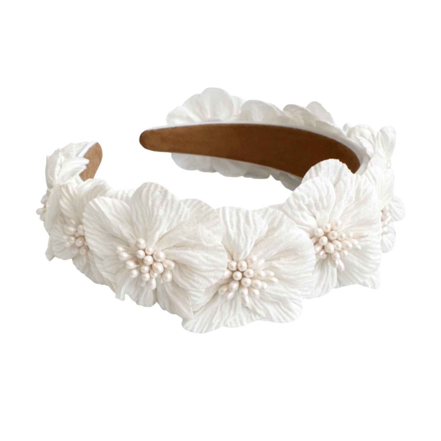 White floral headband with brown hair clip on a white background