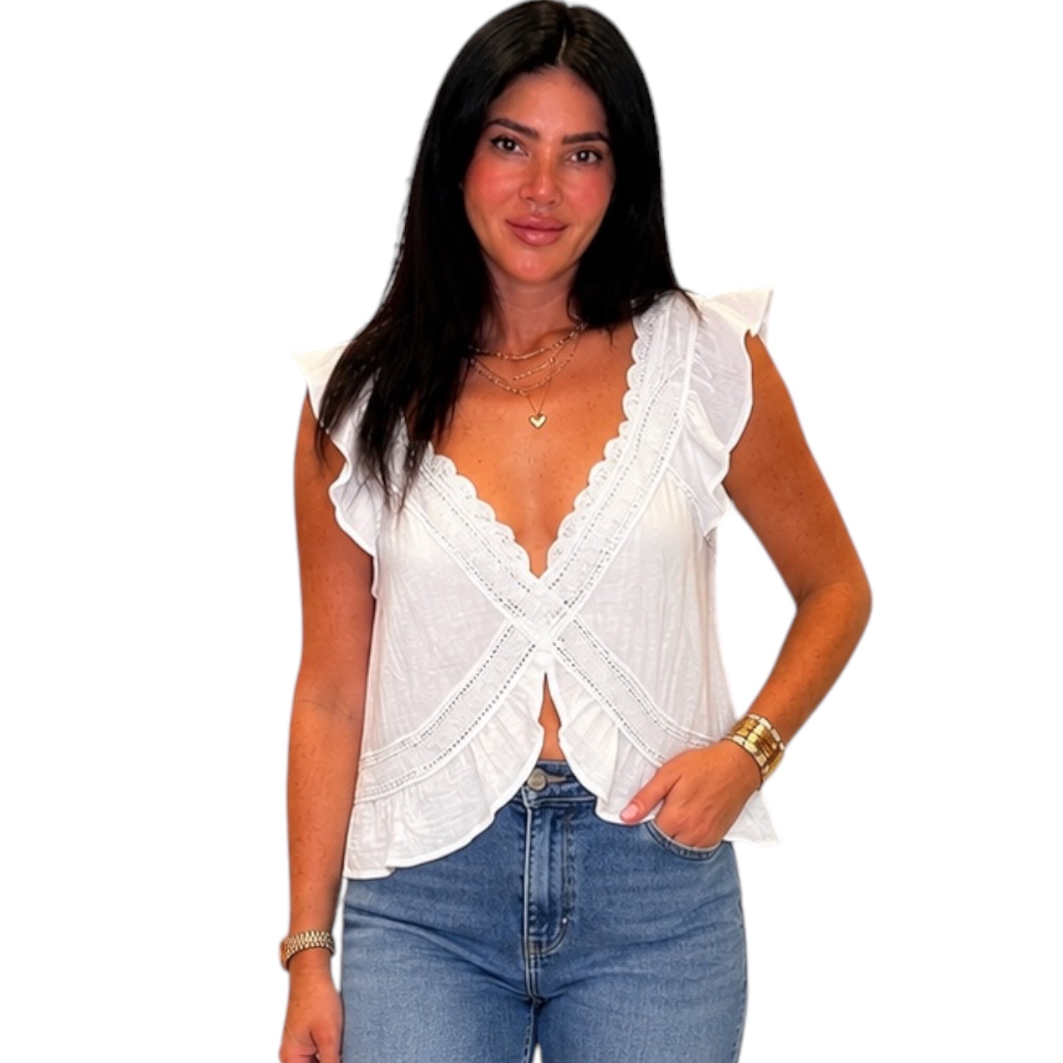 Woman wearing a white sleeveless top with ruffled shoulders and blue jeans on a white background