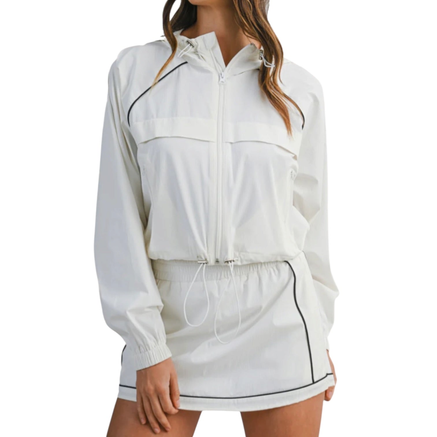 White athletic jacket and skirt set on a white background