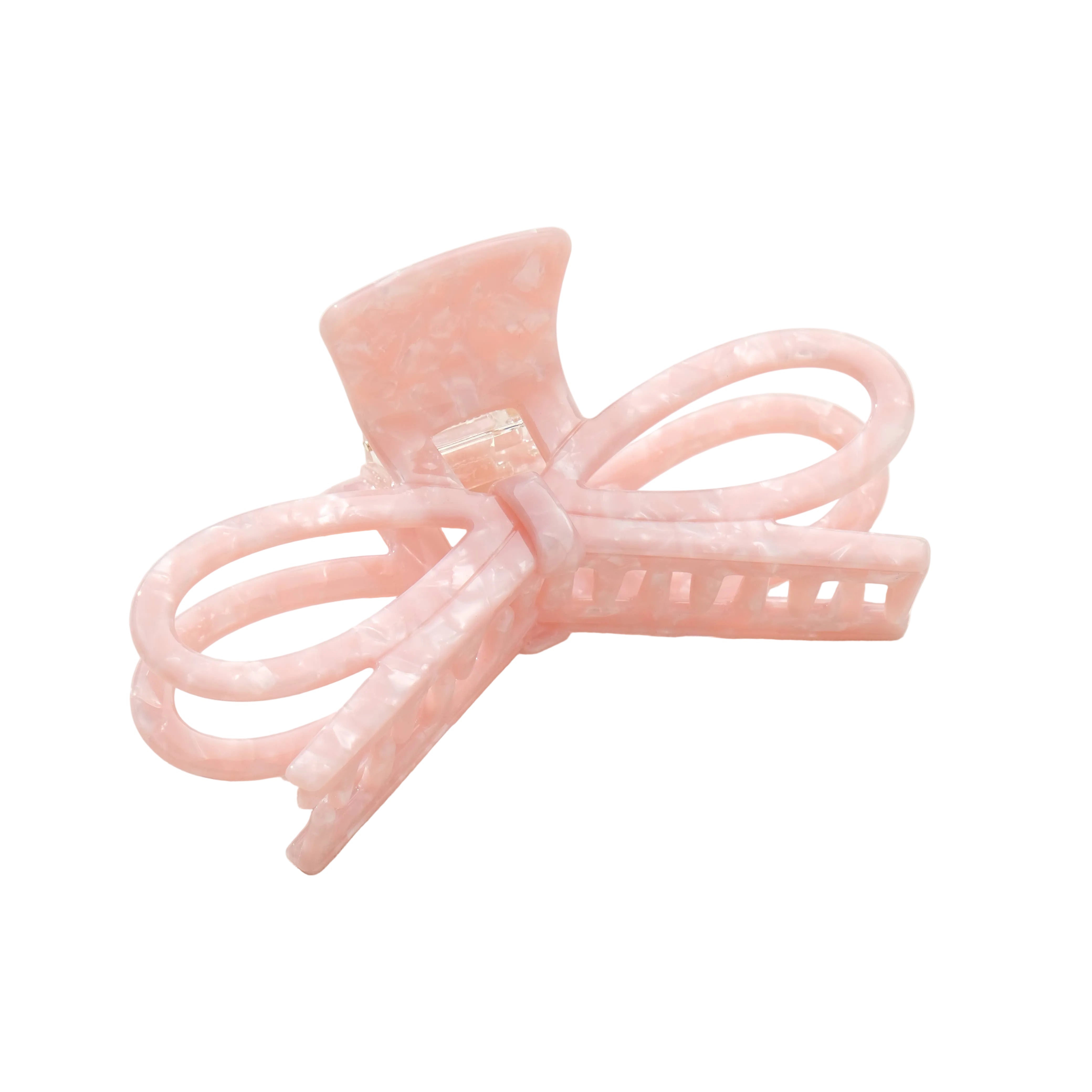 Pink hair clip with bow design on a white background