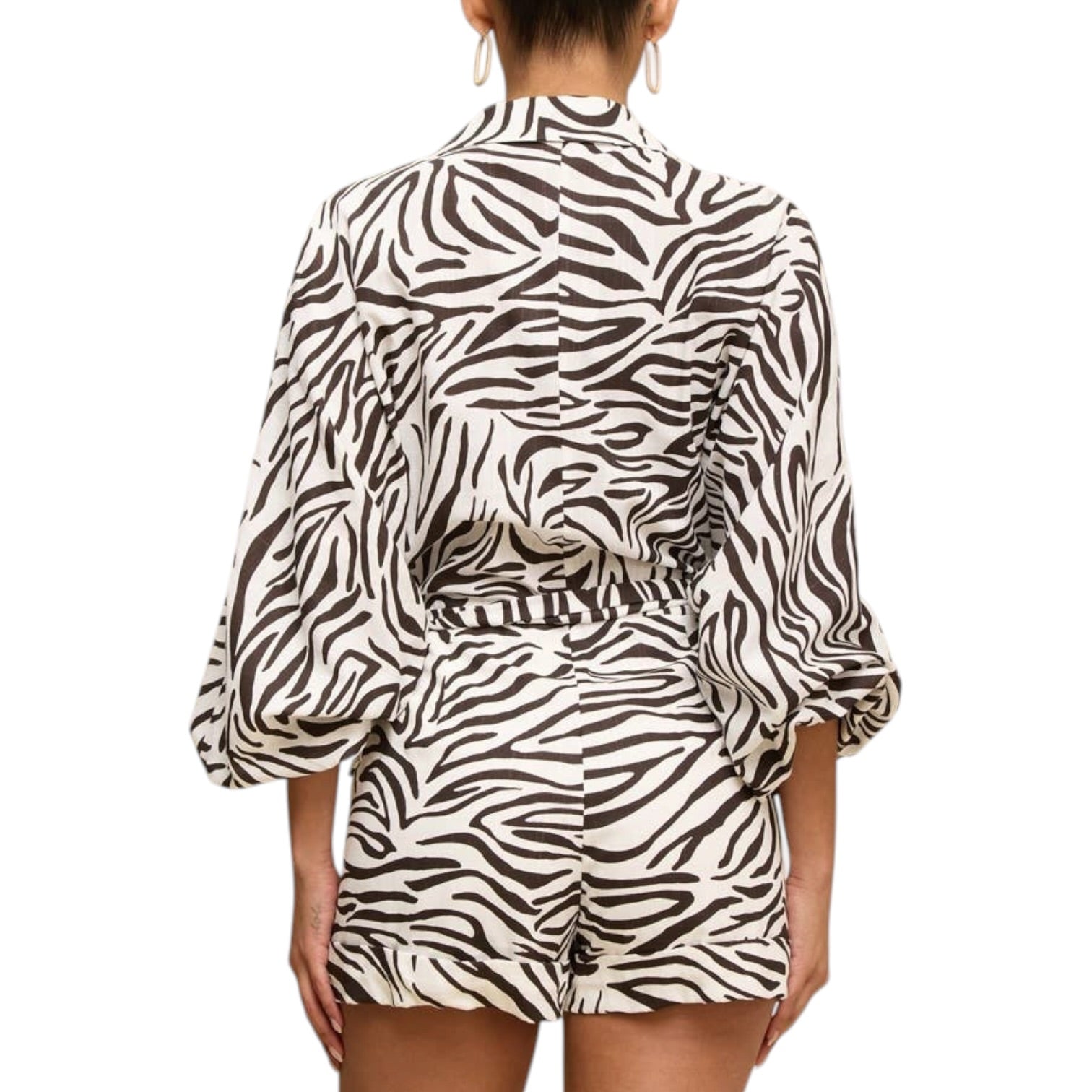 Zebra print outfit with a top and shorts on a white background