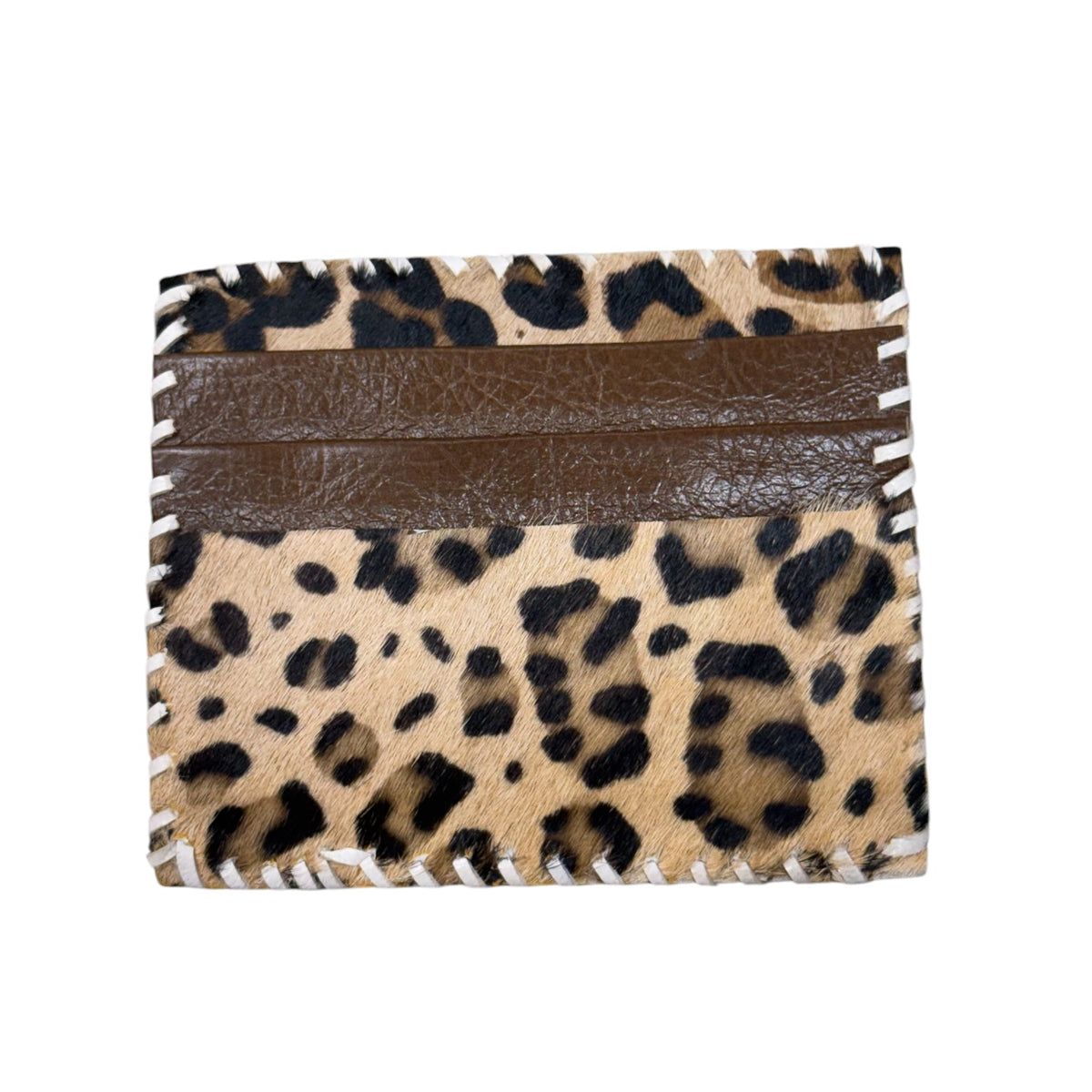 A small card holder or wallet made from leopard print cowhide with a smooth brown faux-leather horizontal band across the top, photographed on a plain white background.