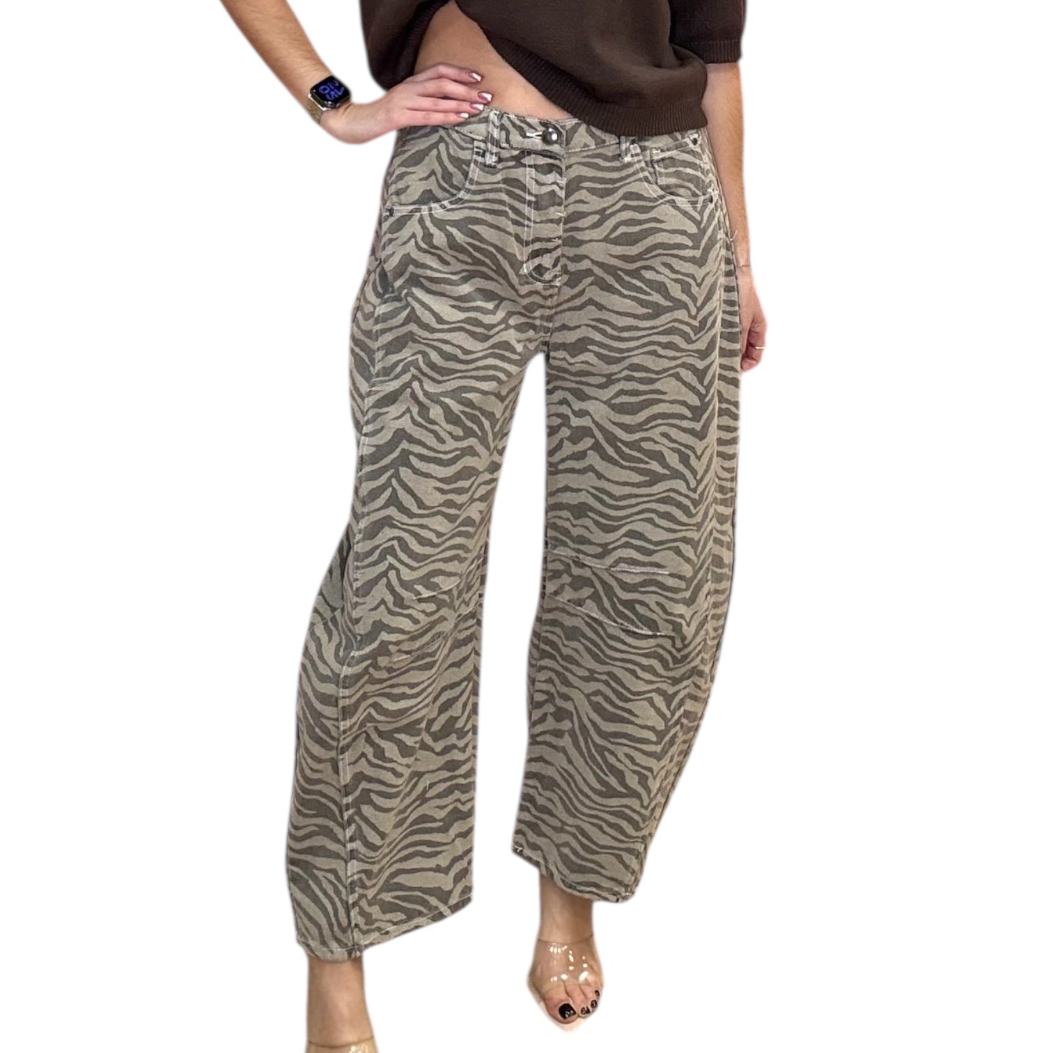 Person wearing zebra print pants on a white background